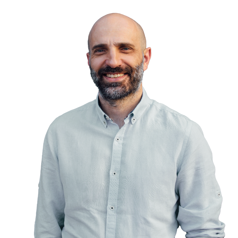 An startup employee in a blue shirt smiling