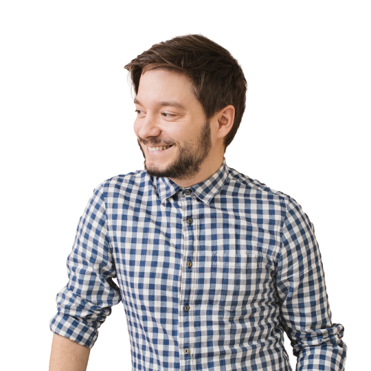 A startup employee wearing a blue checkered shirt