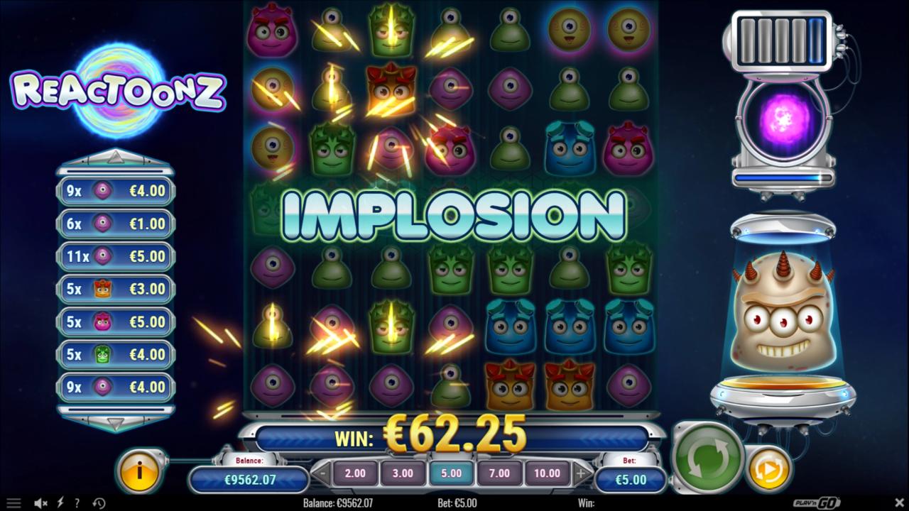 Reactoonz slot game showing the Implosion Quantum Feature transforming symbols into Wilds and removing adjacent symbols from the game grid.