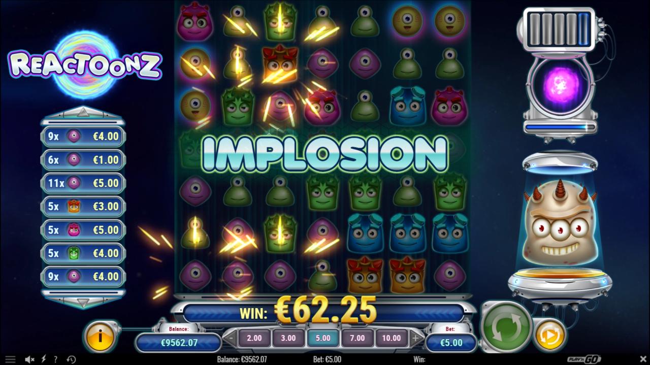 Reactoonz slot game showing the Implosion Quantum Feature transforming symbols into Wilds and removing adjacent symbols from the game grid.