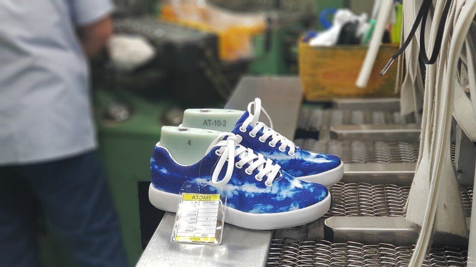In the Factory: Producing Tie-Dye Blue Atoms