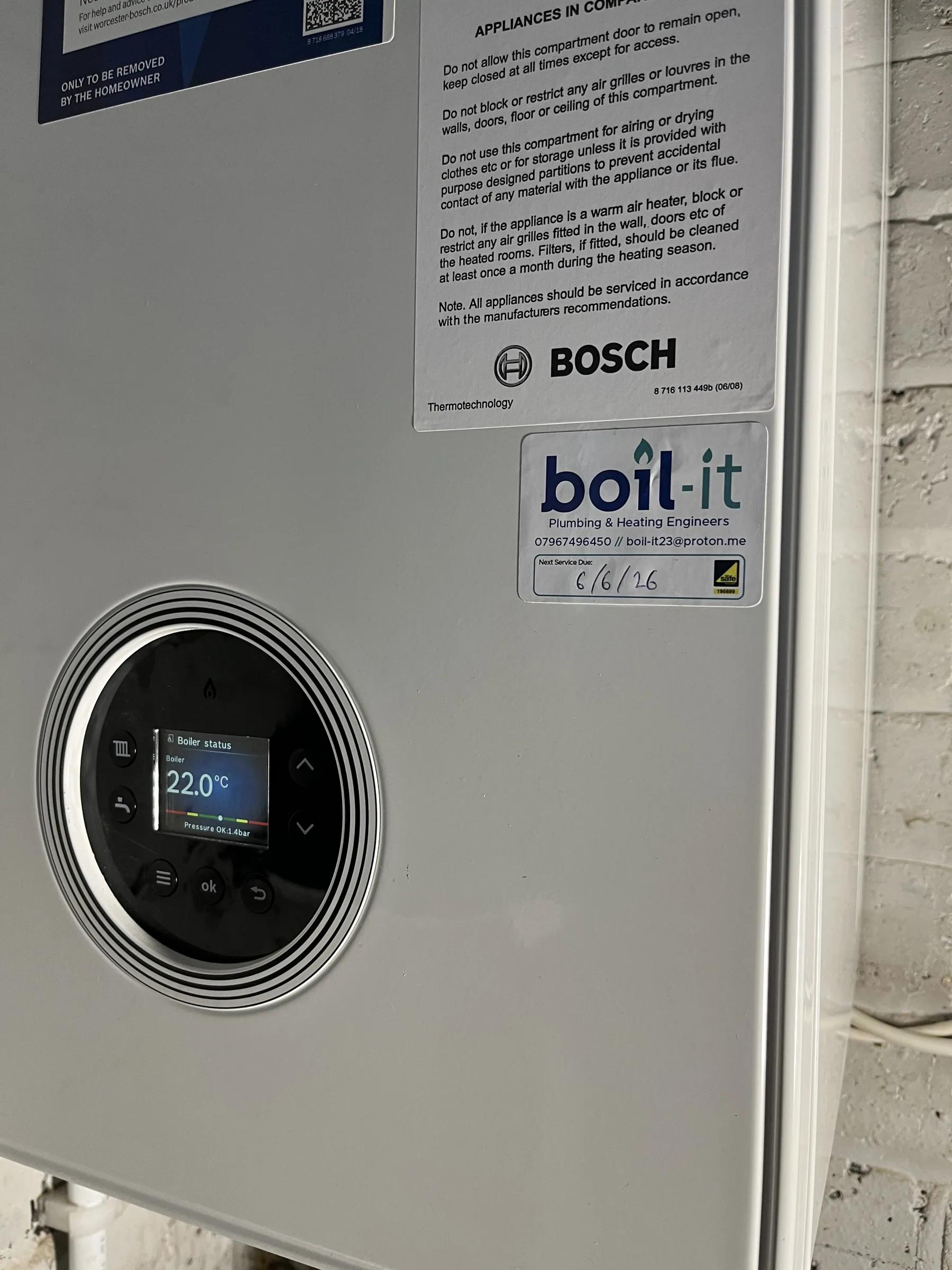 A newly fitted Worcester boiler carrying the boil-it badge, with the pipework tidied in