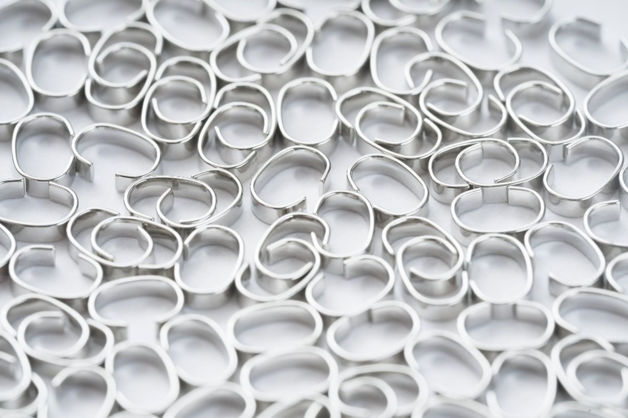 Coated ring travellers — precision manufactured