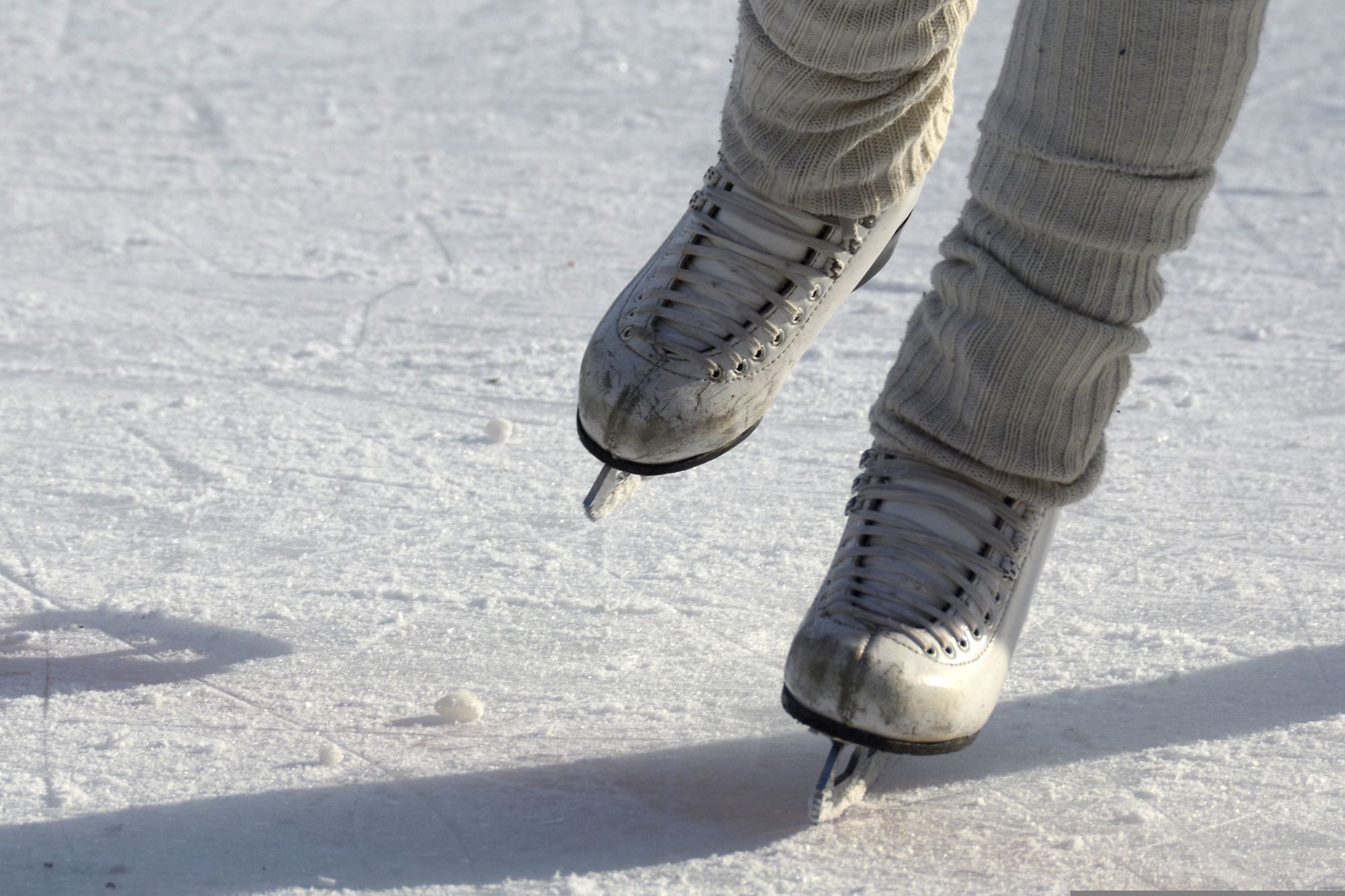 A pair of skates on ice.