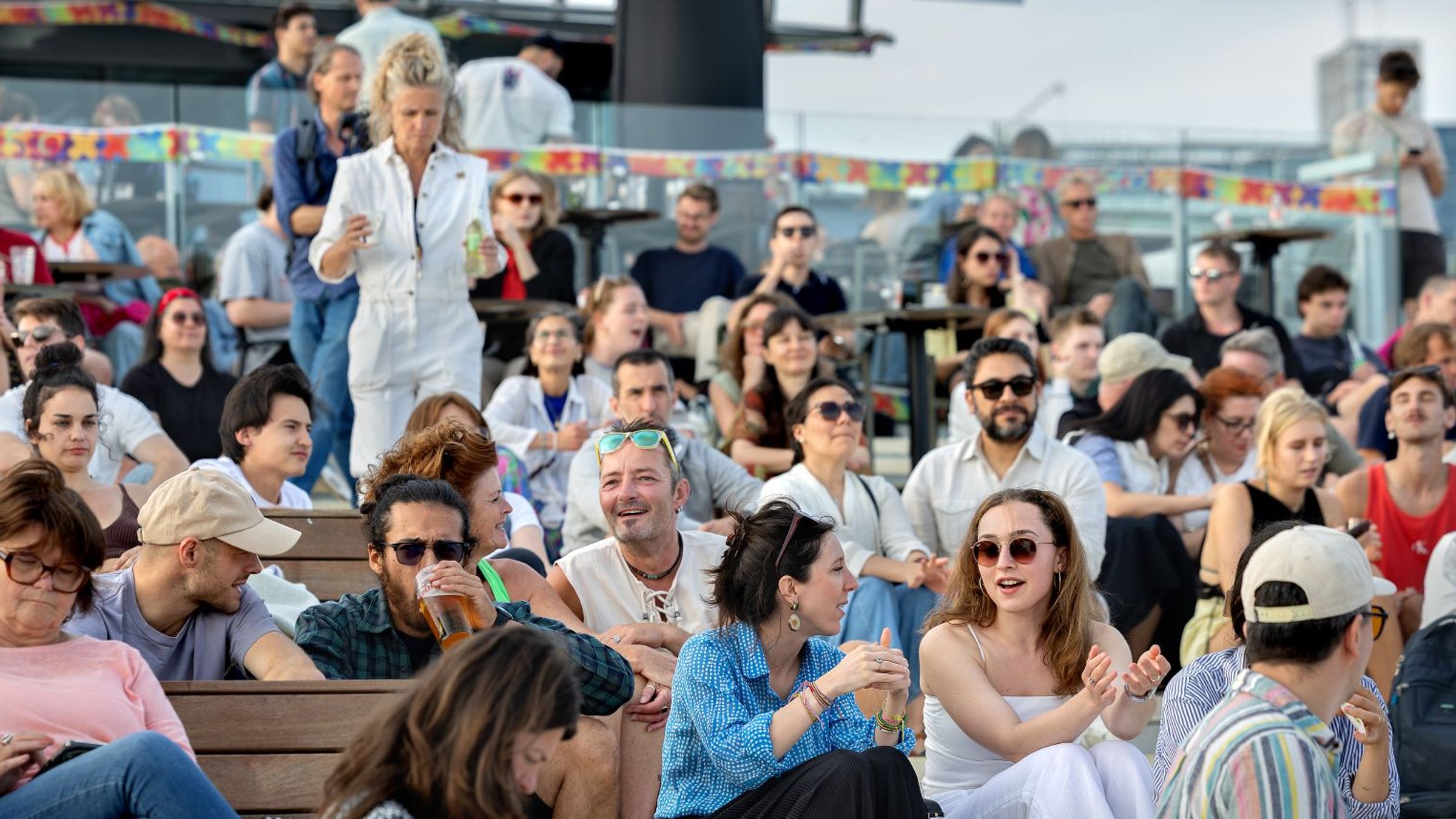 audience relaxing on the rooftop