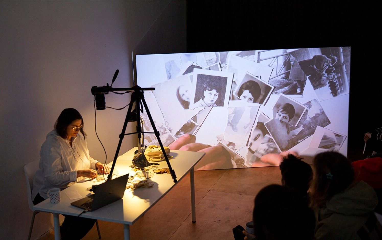 A woman is browsing through pictures