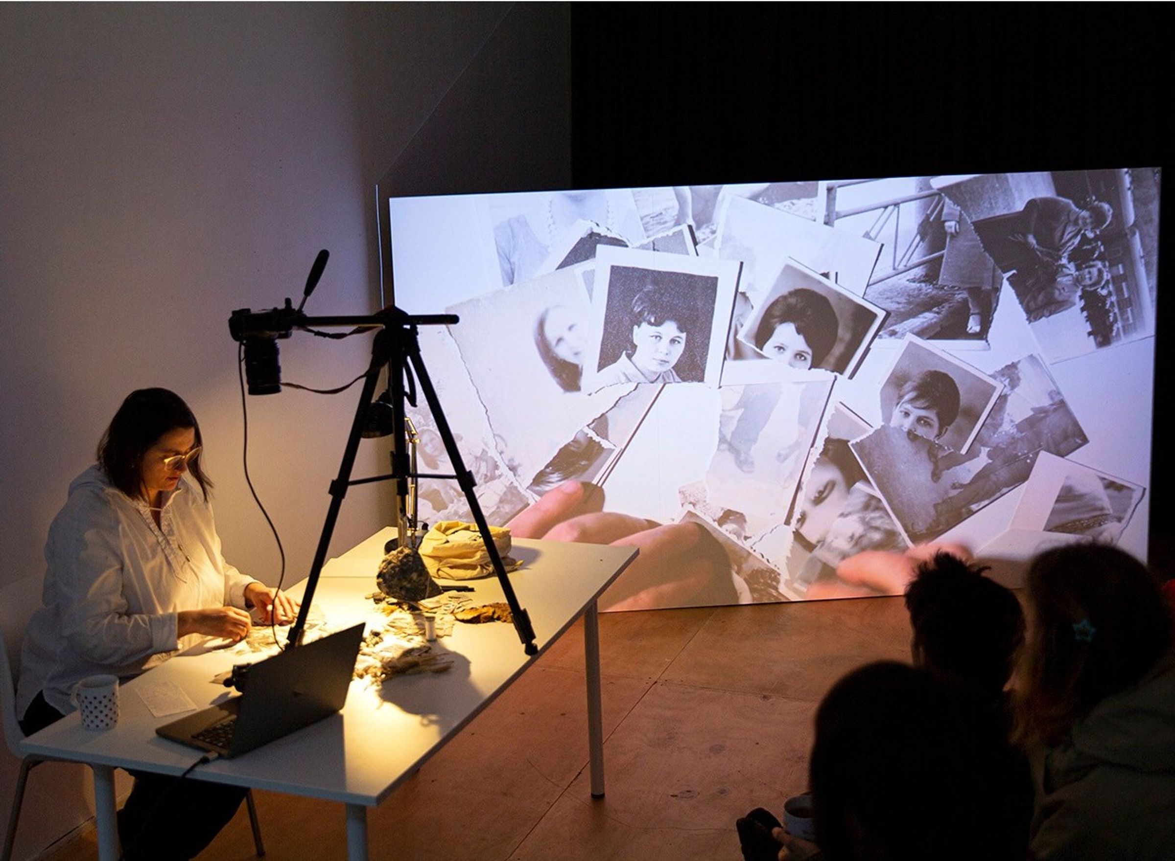 A woman is browsing through pictures