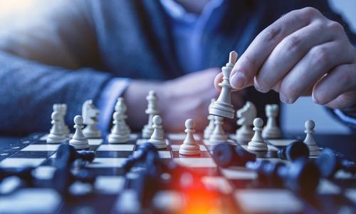 chess player preparing a new strategic move