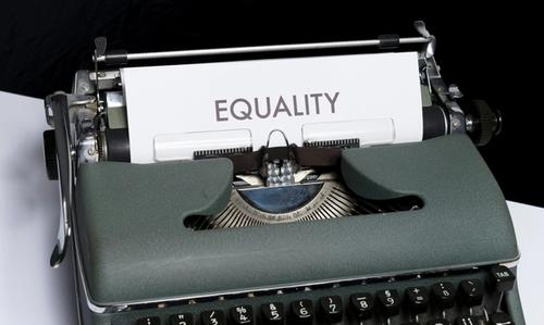 typewriter with a paper that says equality