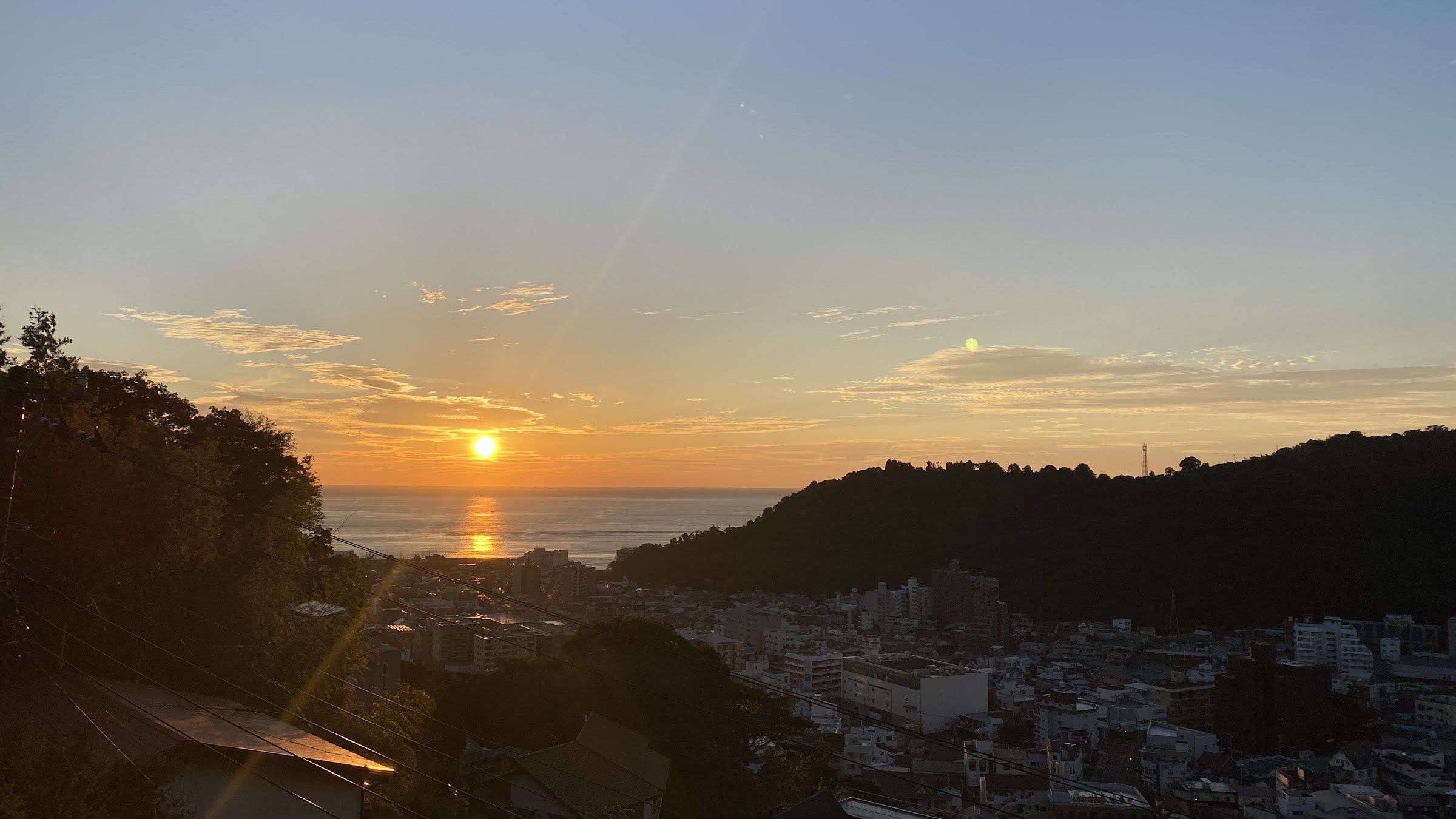 Sunset over Yugawara town and the sea