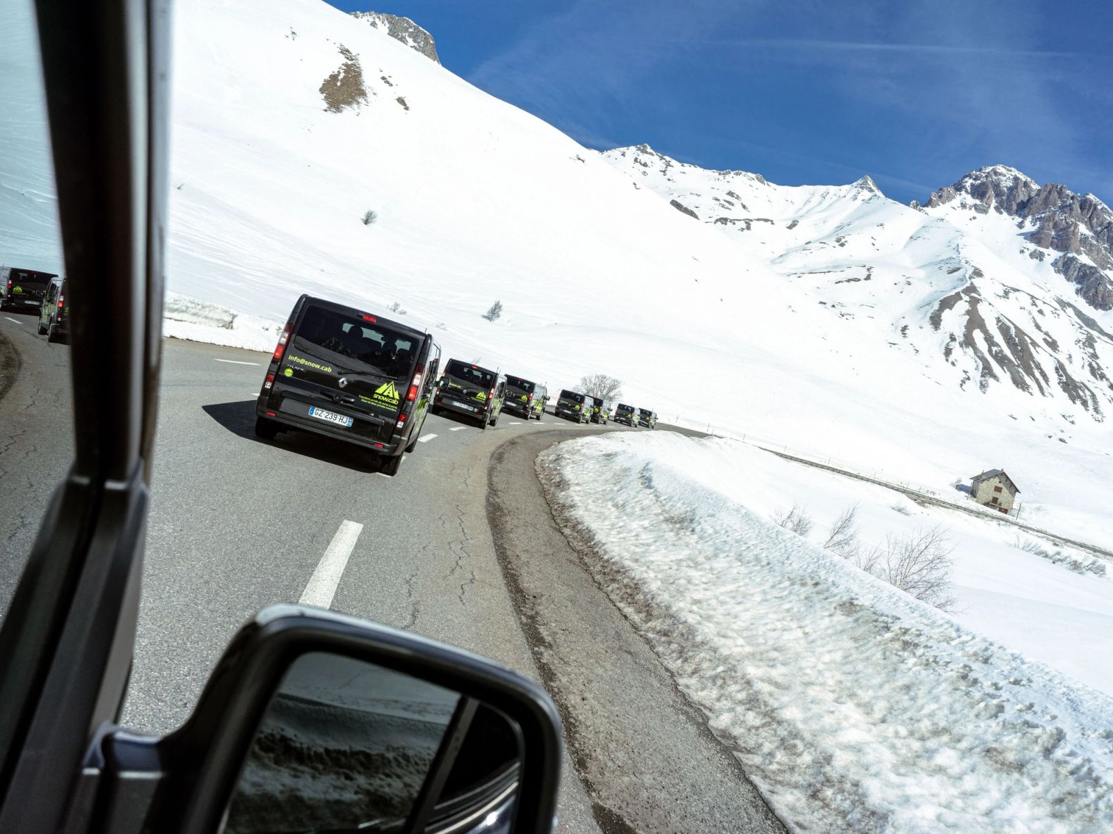 Snow Cab minibusses driving the col du lauteret