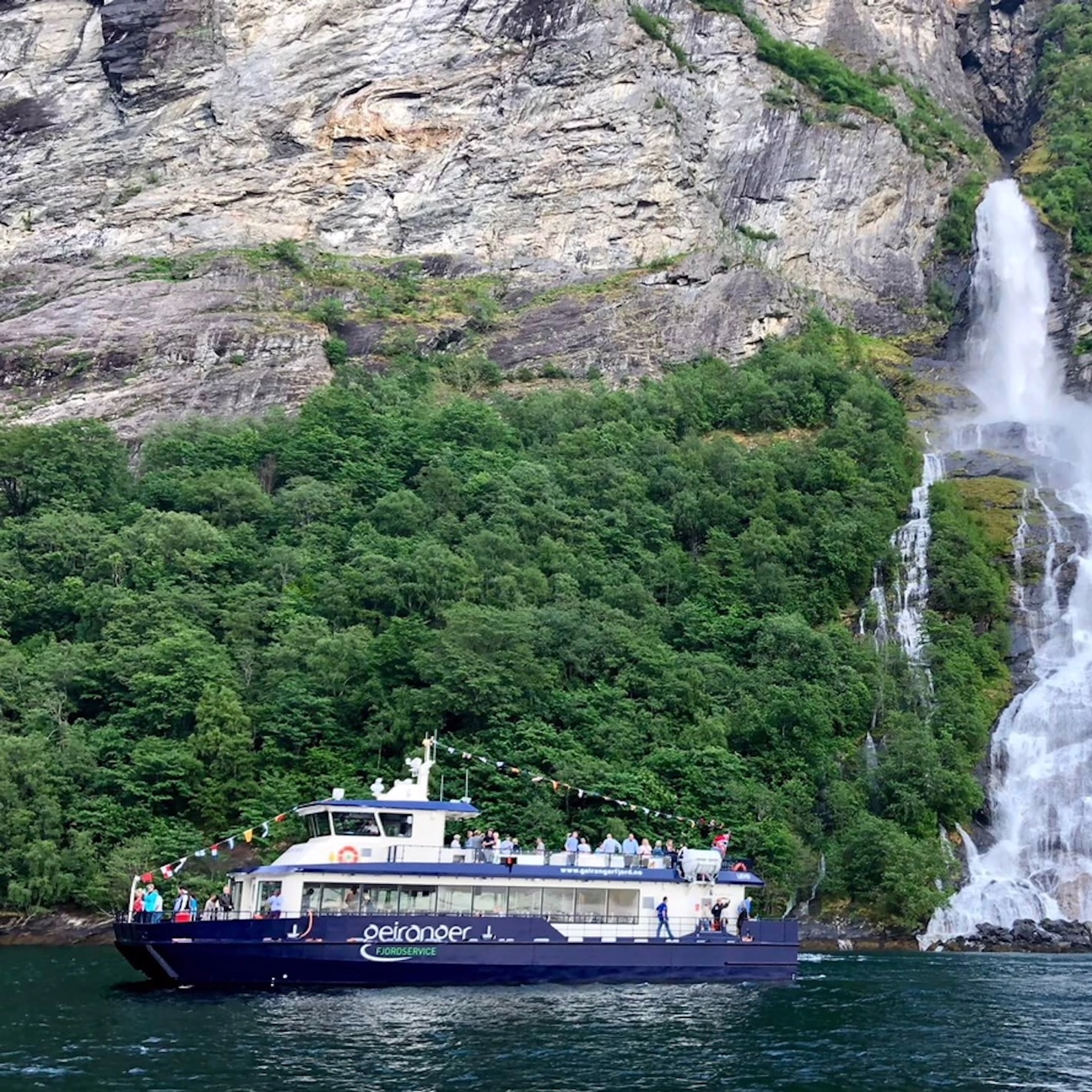 Passing by waterfalls - Fjord cruise on the Geirangerfjord - Ålesund, Norway