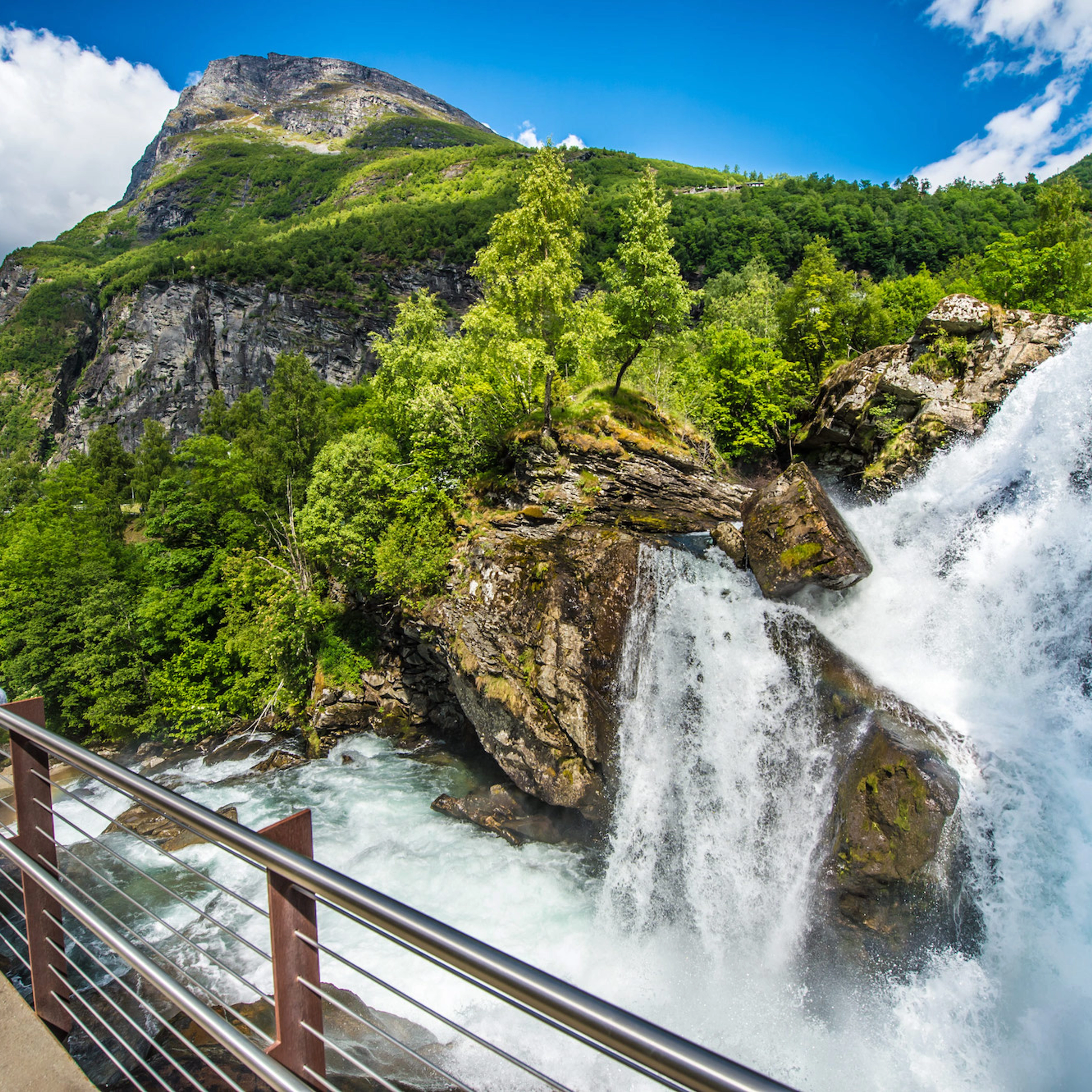 Waterfall walk in Geiranger - view of the cascading waterfall, Norway