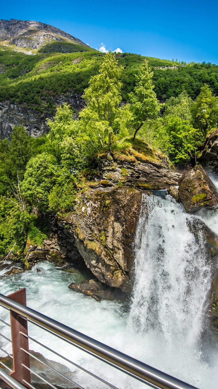 Waterfall walk in Geiranger - view of the cascading waterfall, Norway