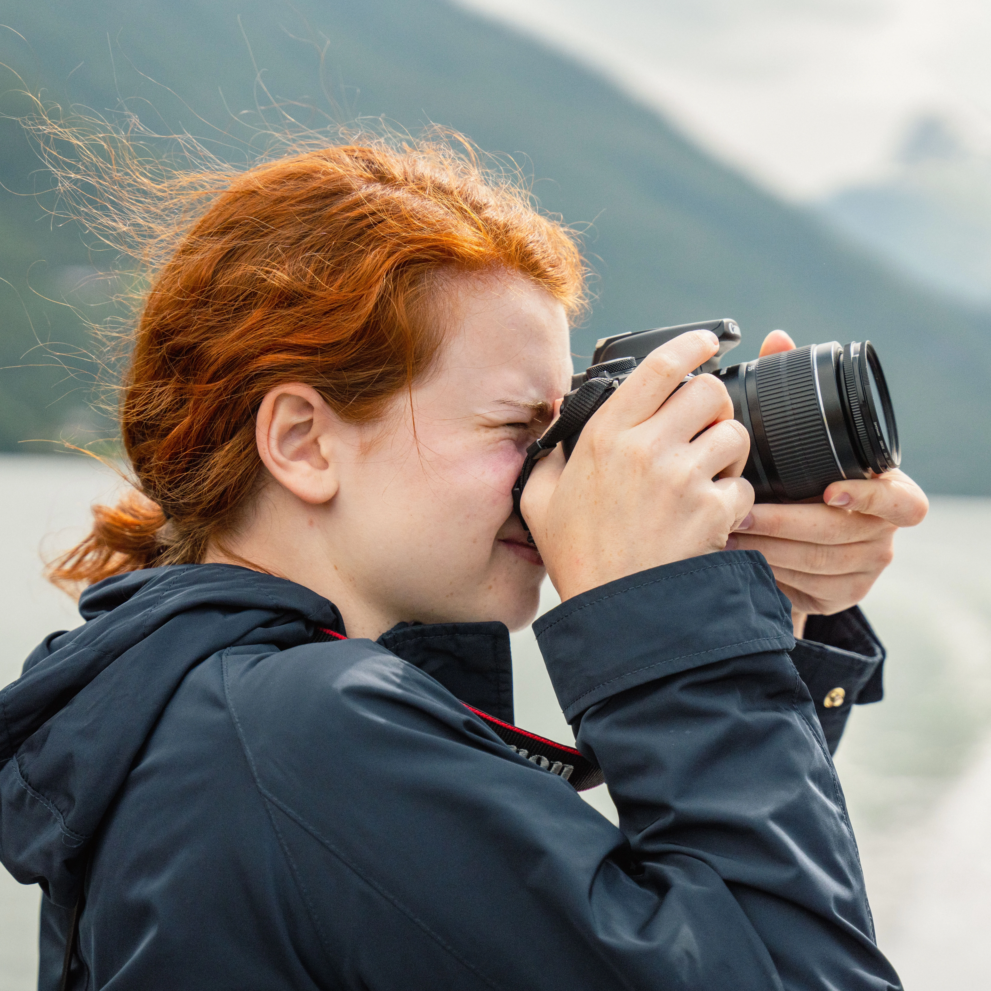 Girl photographing the Sognefjord - Norway