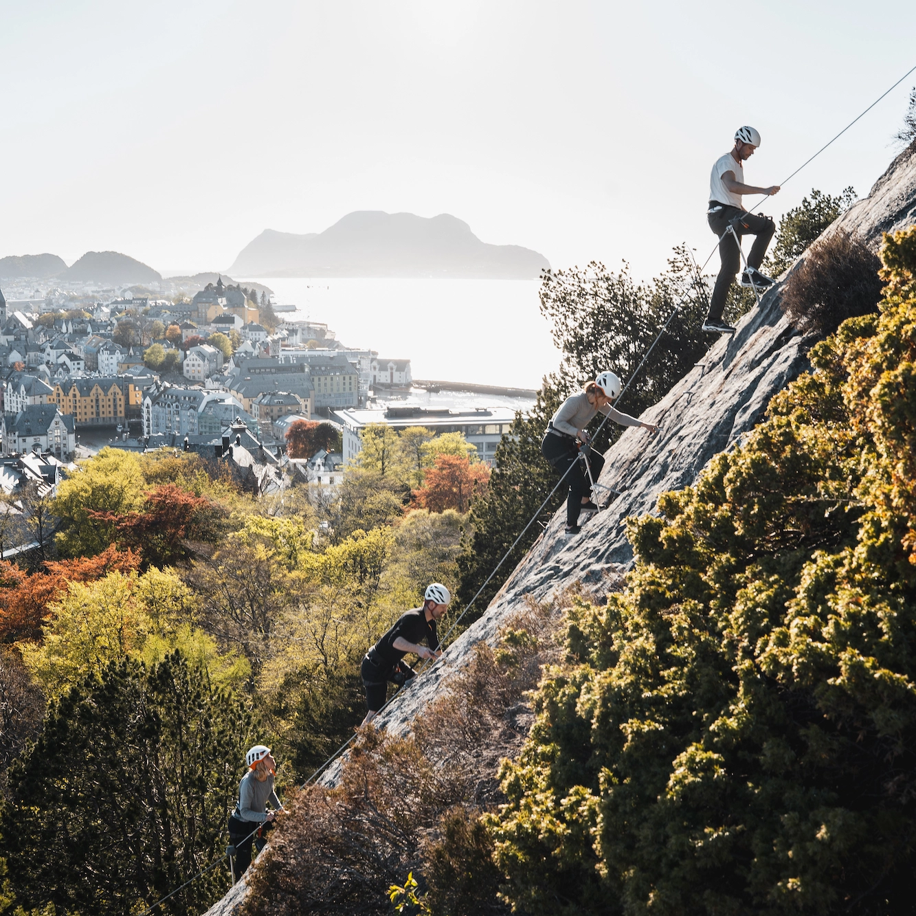 Autumn climb Via Ferrata Ålesund Climbers on Via Ferrata route during autumn season in Ålesund.