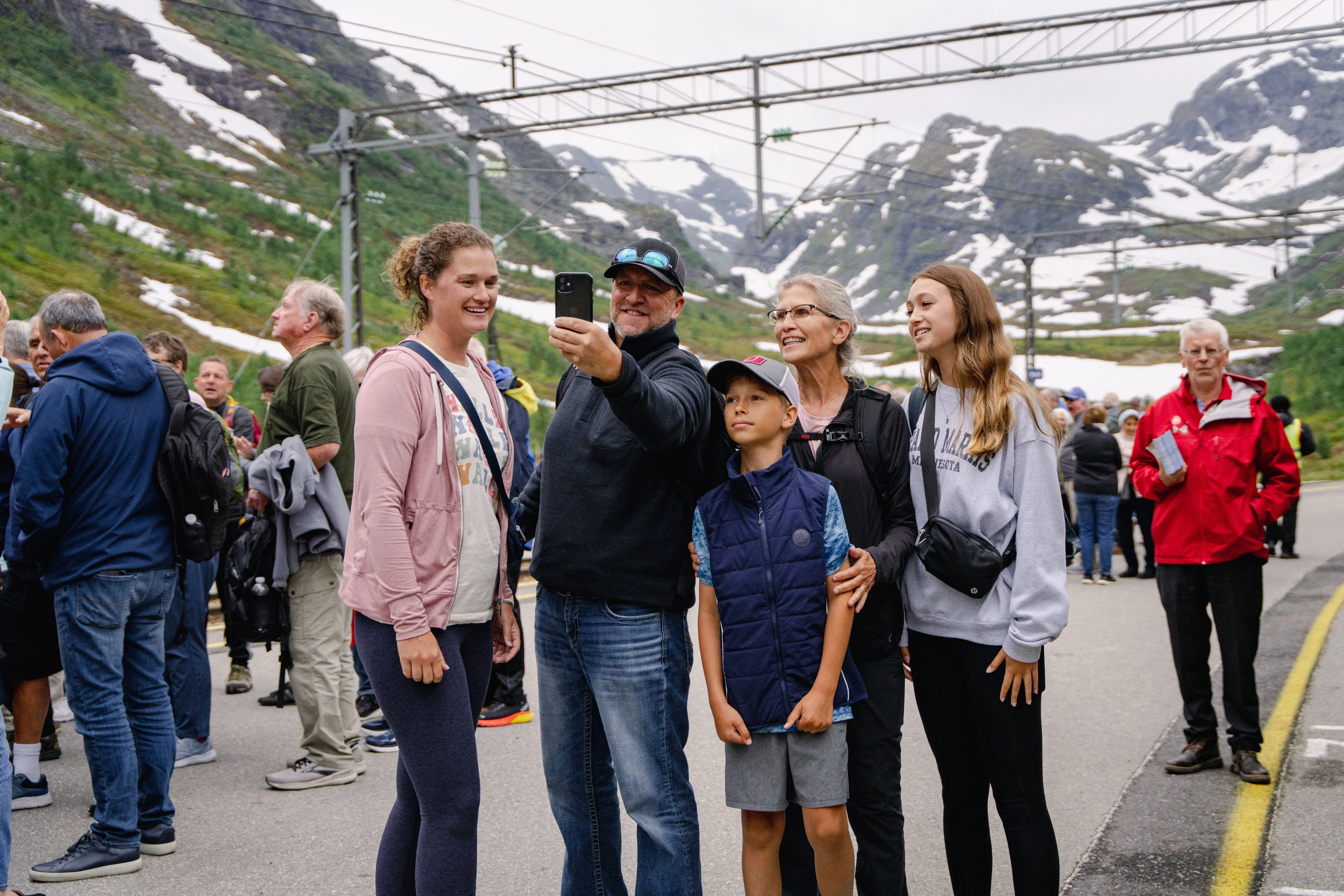 Family taking selfie next to the Flåm Railway