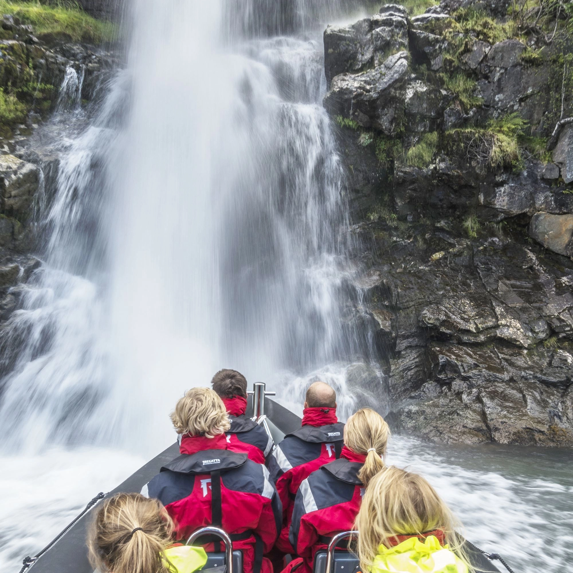 Rushing waterfalls on a RIB boat trip on the Hardangerfjord from Odda, Norway