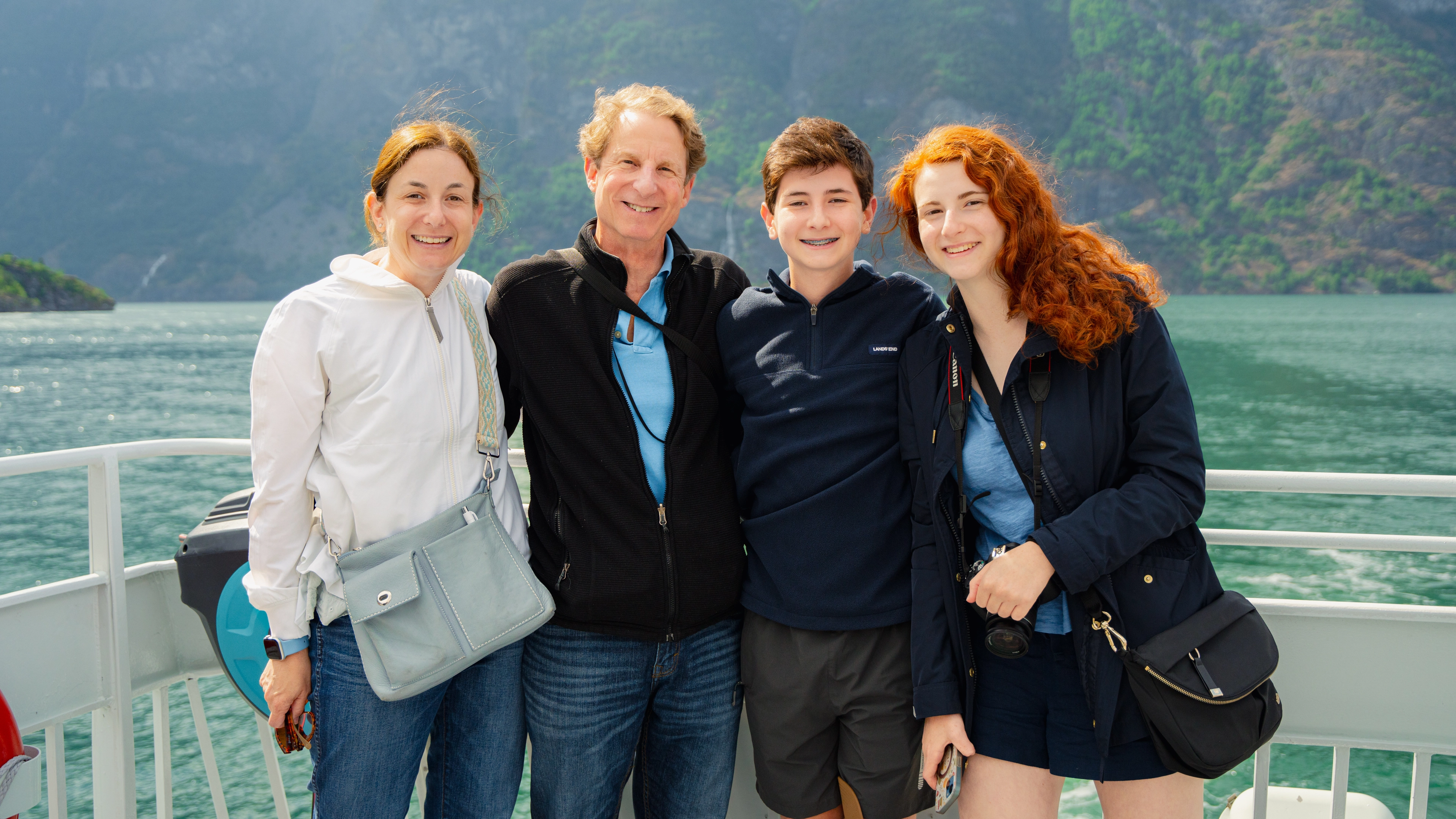 Family of four on deck on a fjord cruise  - Sognefjord in a Nutshell
