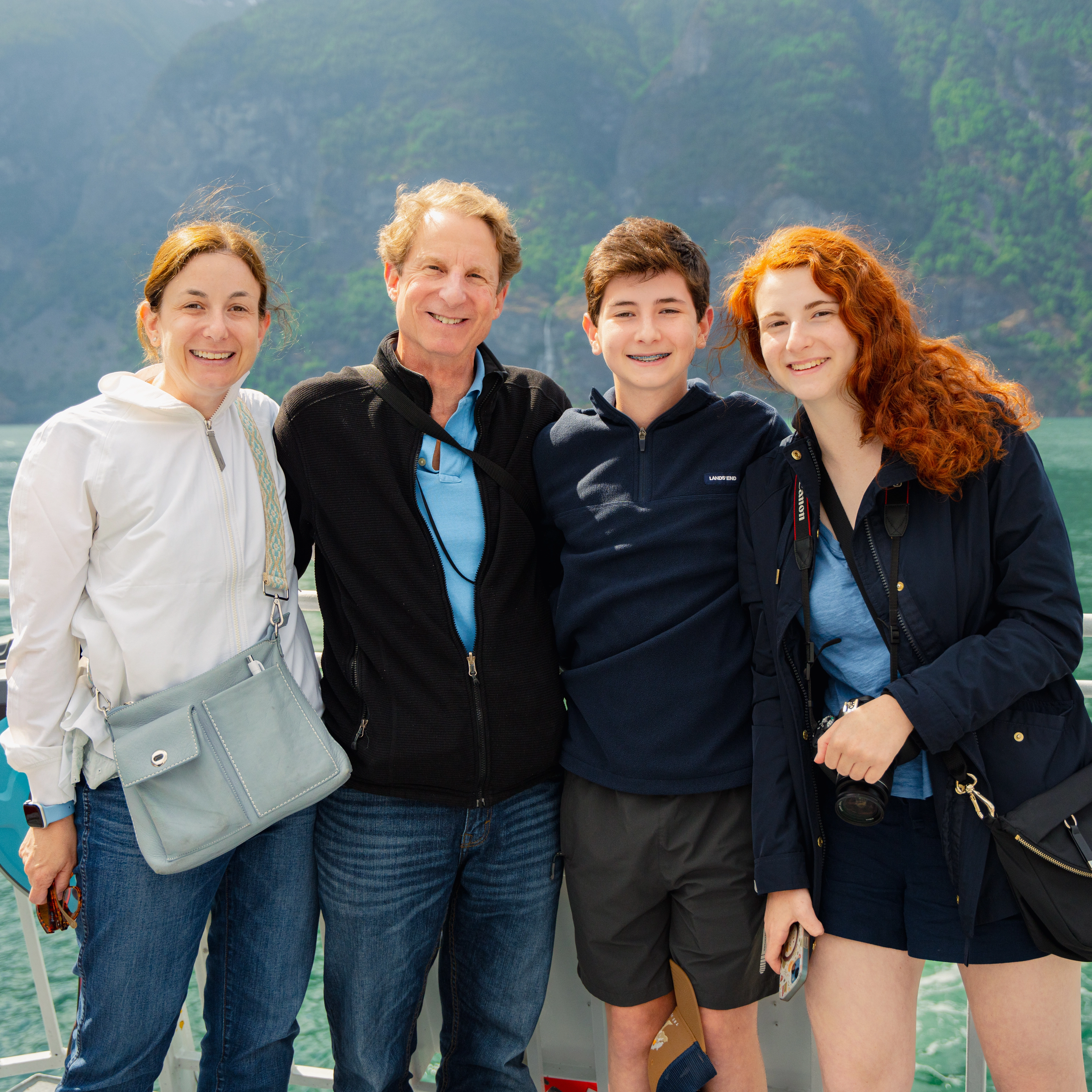 Family of four on deck on a fjord cruise  - Sognefjord in a Nutshell