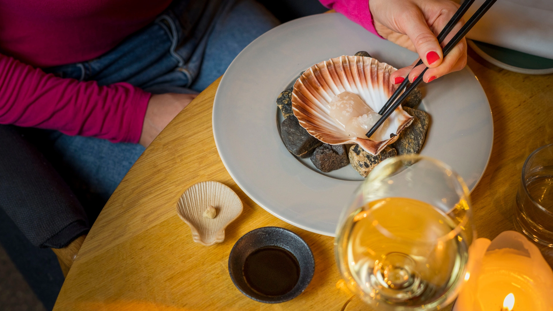 Seafood Treasures of Ålesund Fresh Norwegian scallop served in its shell at Bro Restaurant in Ålesund, showcasing local seafood gastronomy