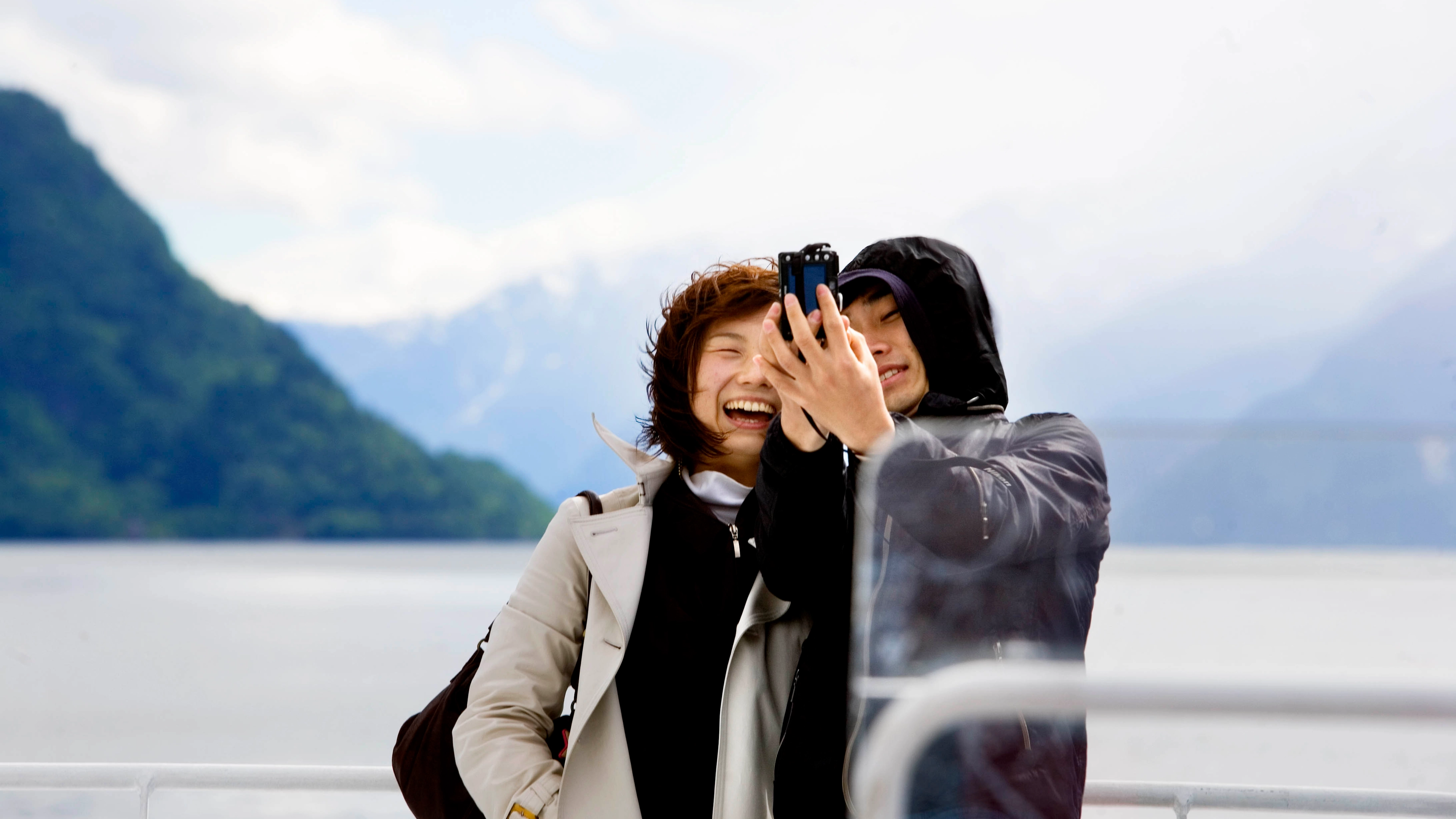 Happy couple on romantic holiday travelling on the famous Norway in a nutshell® with Fjord Tours