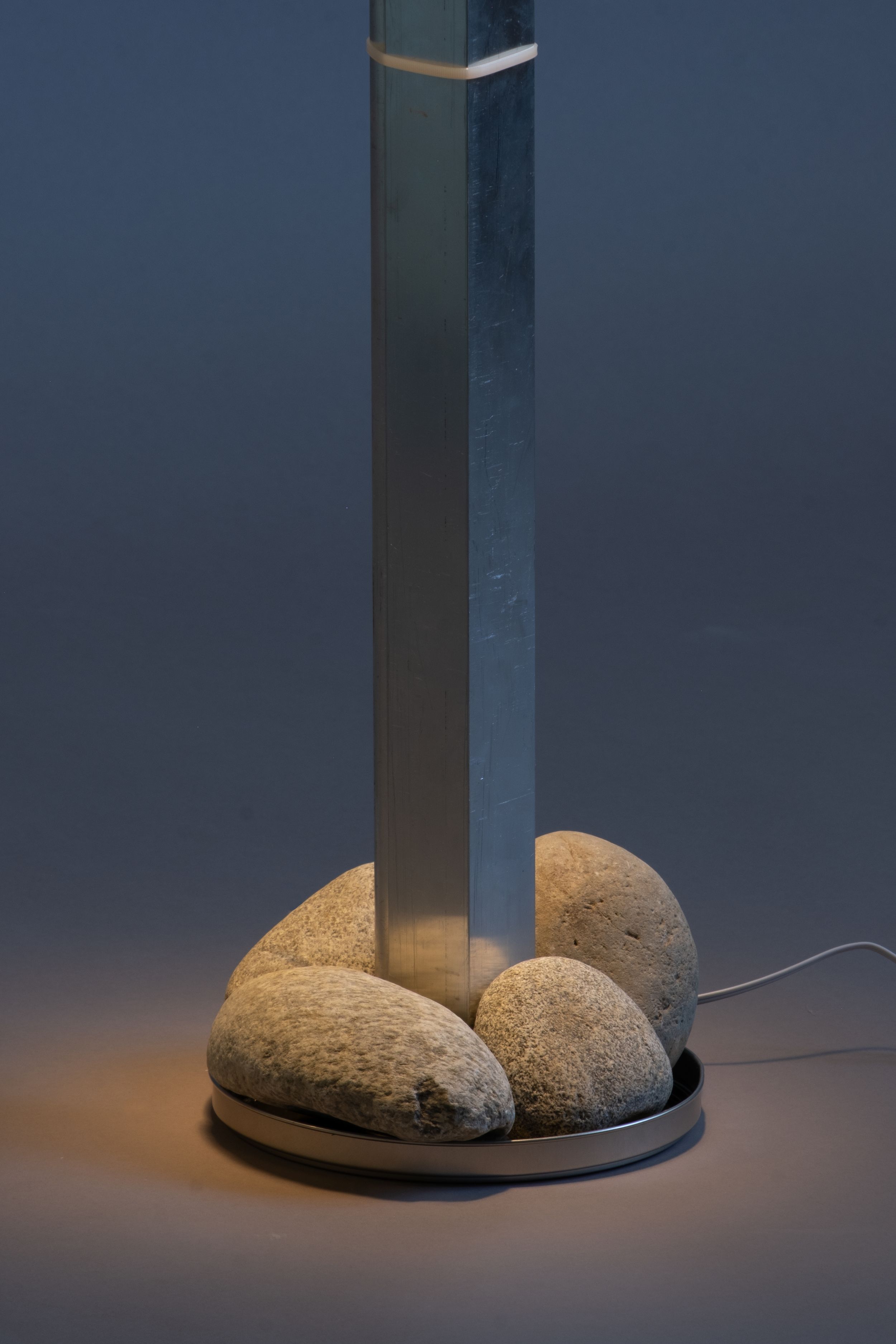 Detail of lamp with stone base and aluminium body