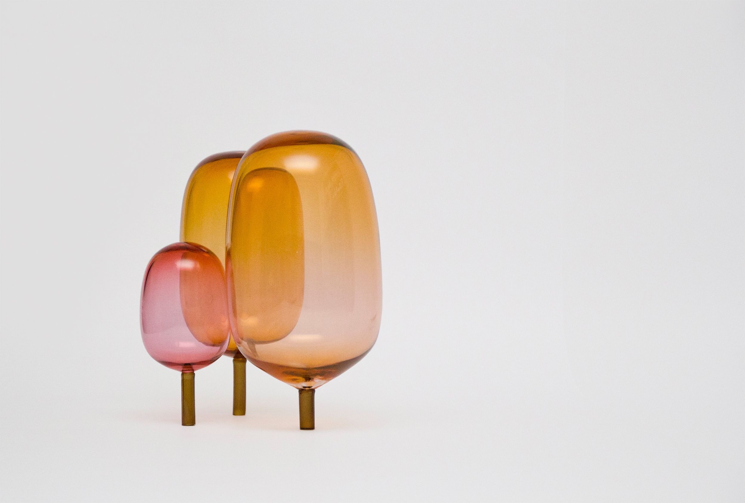 The woods designed by Jonas Stokke, Øystein Austad and Andreas Engesvik, pink and orange glass sculptures, mouth blown glass