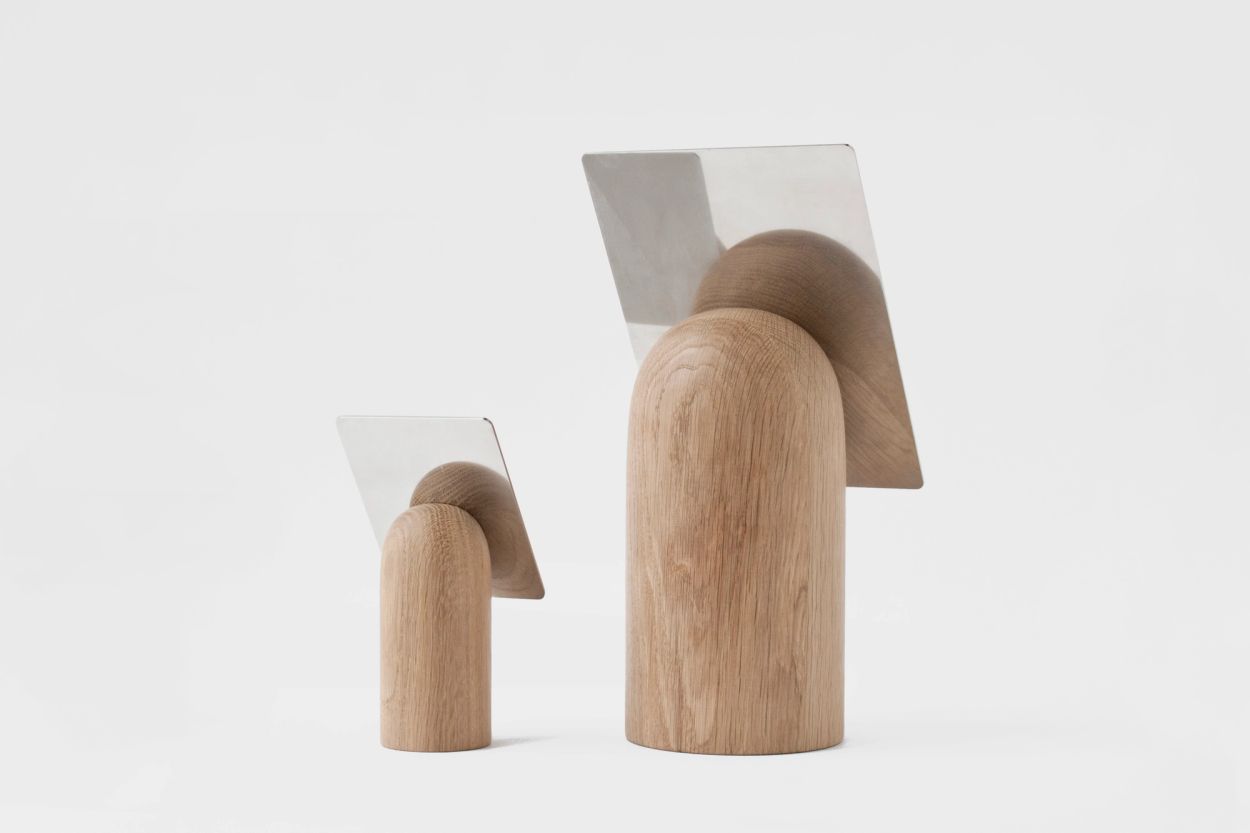 two mirrors with wooden base viewed form behind, designed by jonas stokke and øystein austad