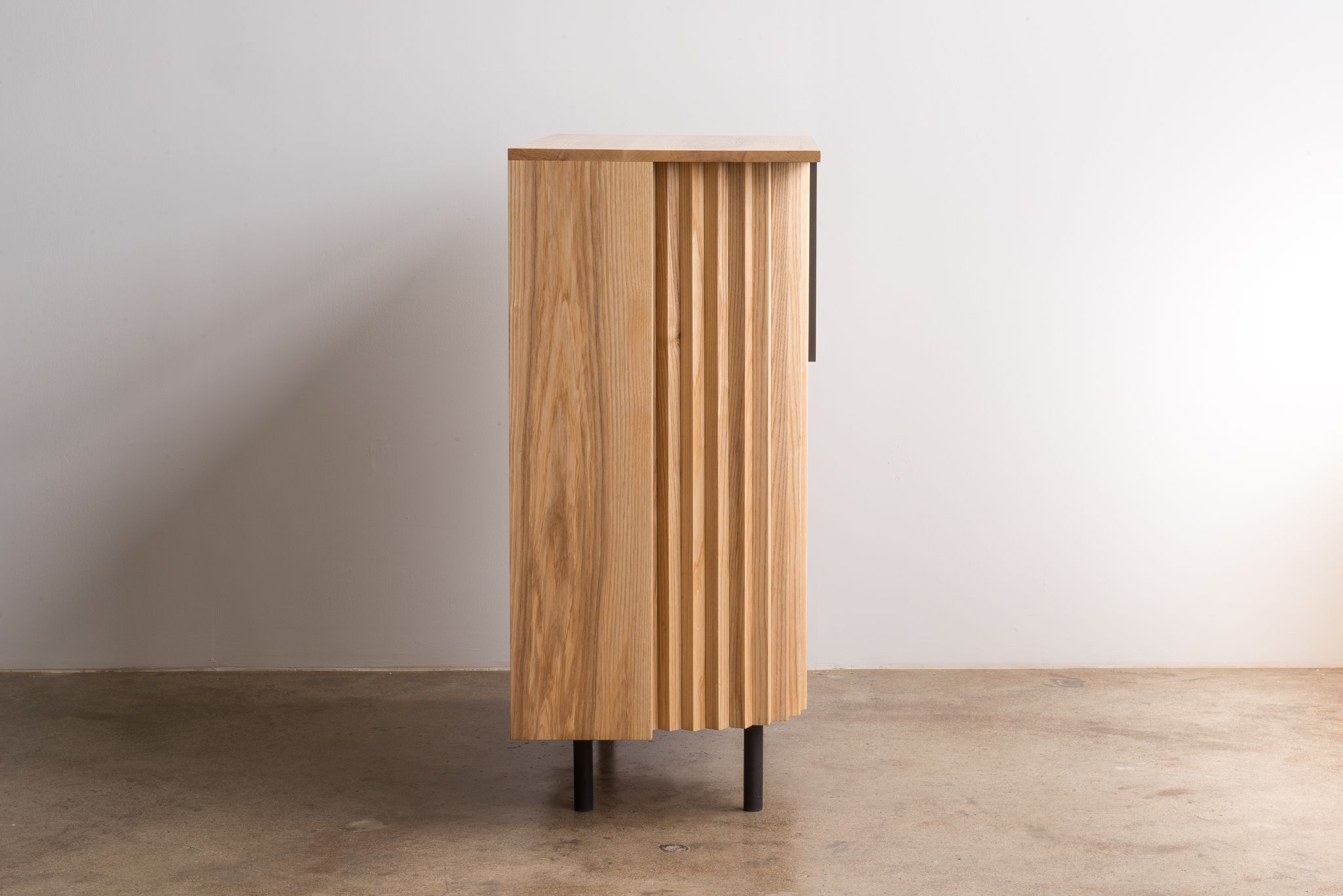 Tambour Cabinet designed by Jonas Stokke, wooden cabinet with sliding doors, side view