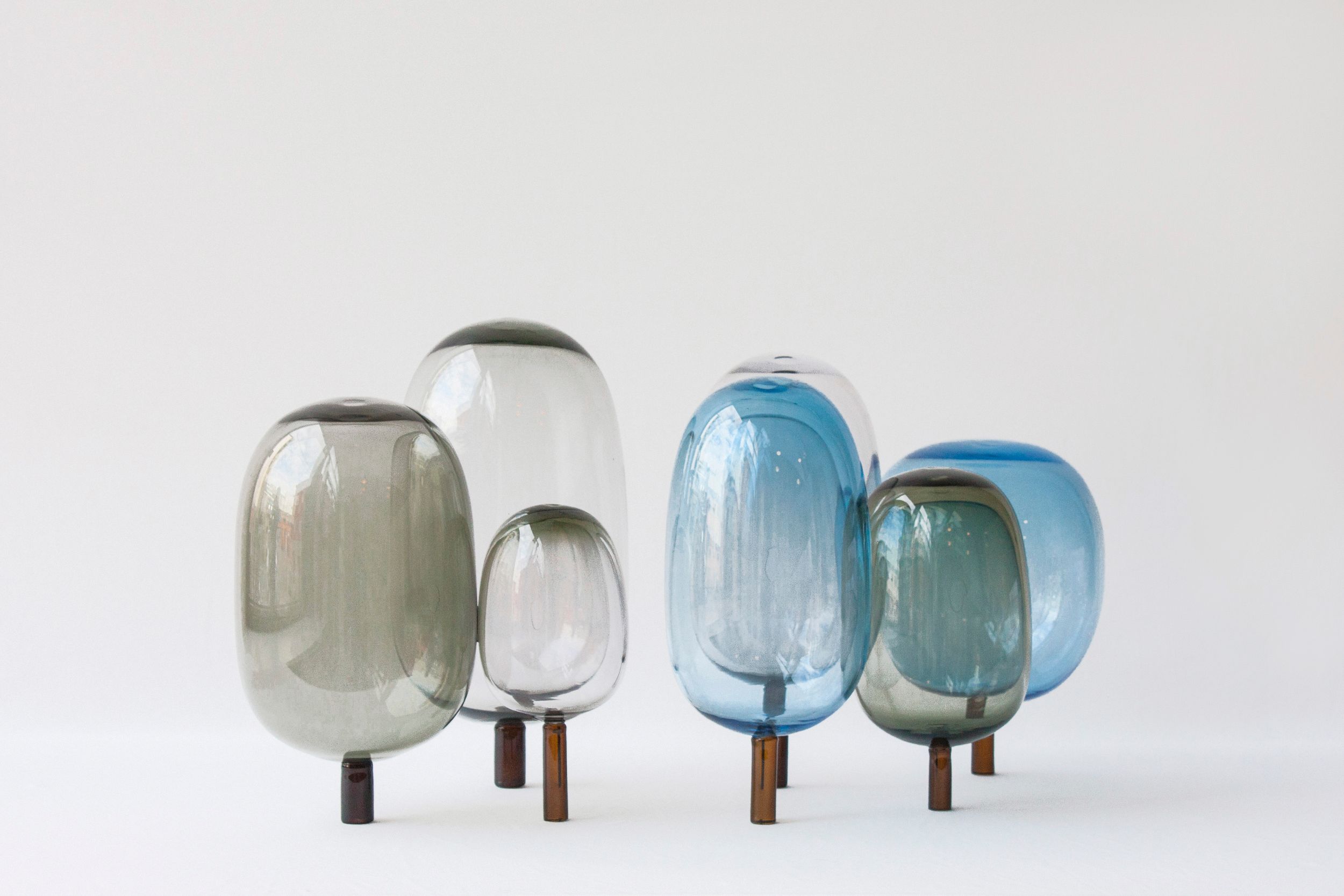 The woods designed by Jonas Stokke, Øystein Austad and Andreas Engesvik, grey and white and blue glass sculptures, mouth blown glass