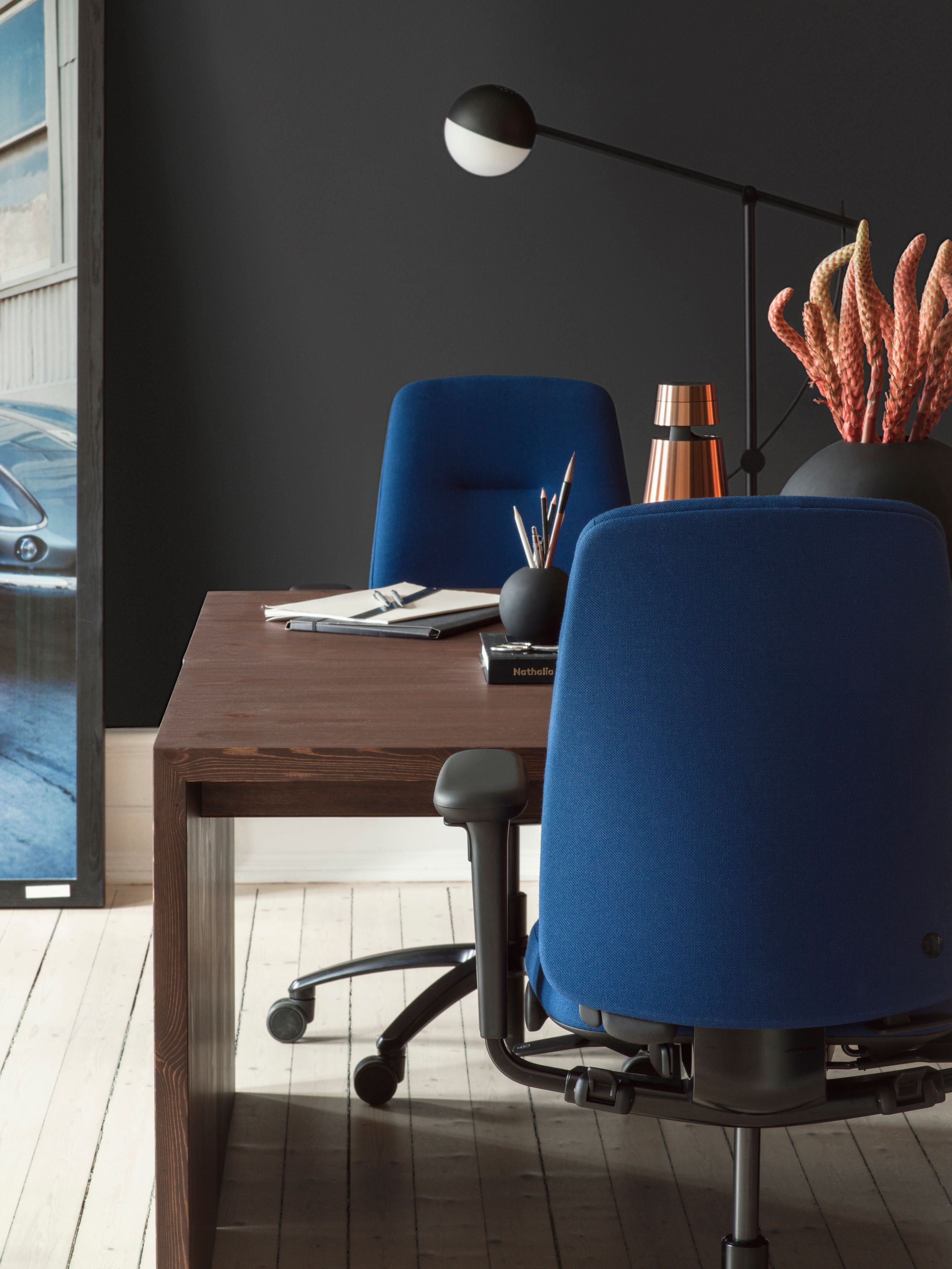 tw blue office chairs, rh logic by a desk