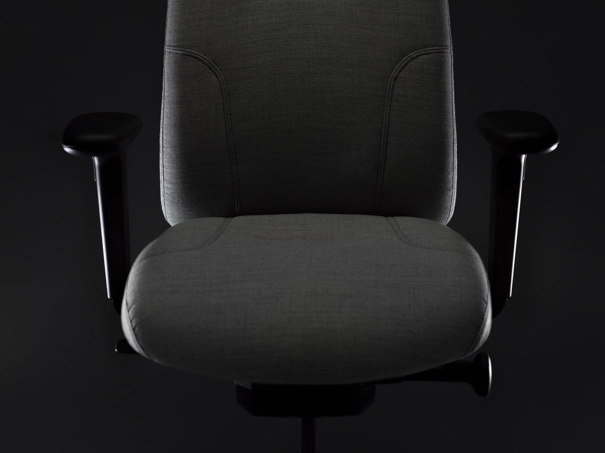 RH Logic redesigned by Jonas Stokke, grey office chair in black surroundings, front side, detail of seat