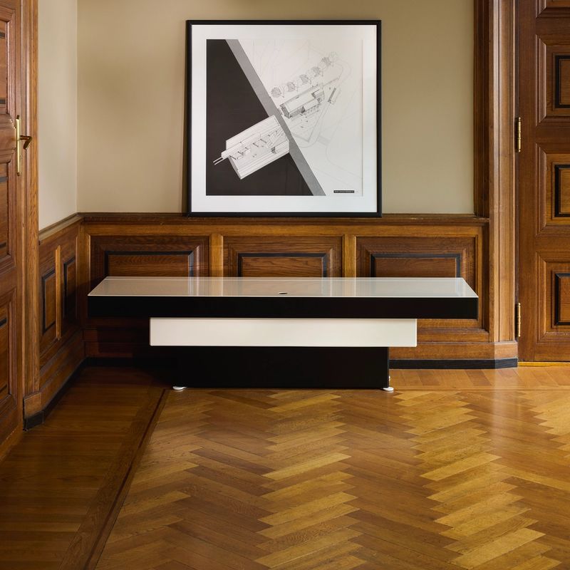 unit, a black and white steel cabinet that steps out like an inverted piramyde.