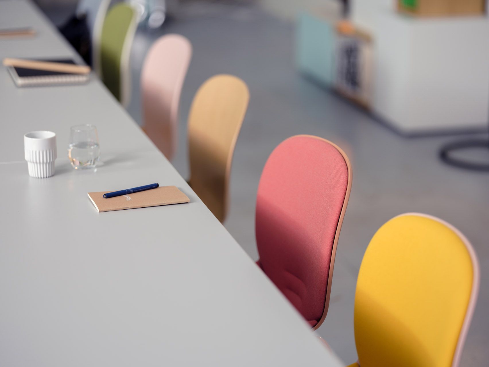 colourful chairbacks next to a table