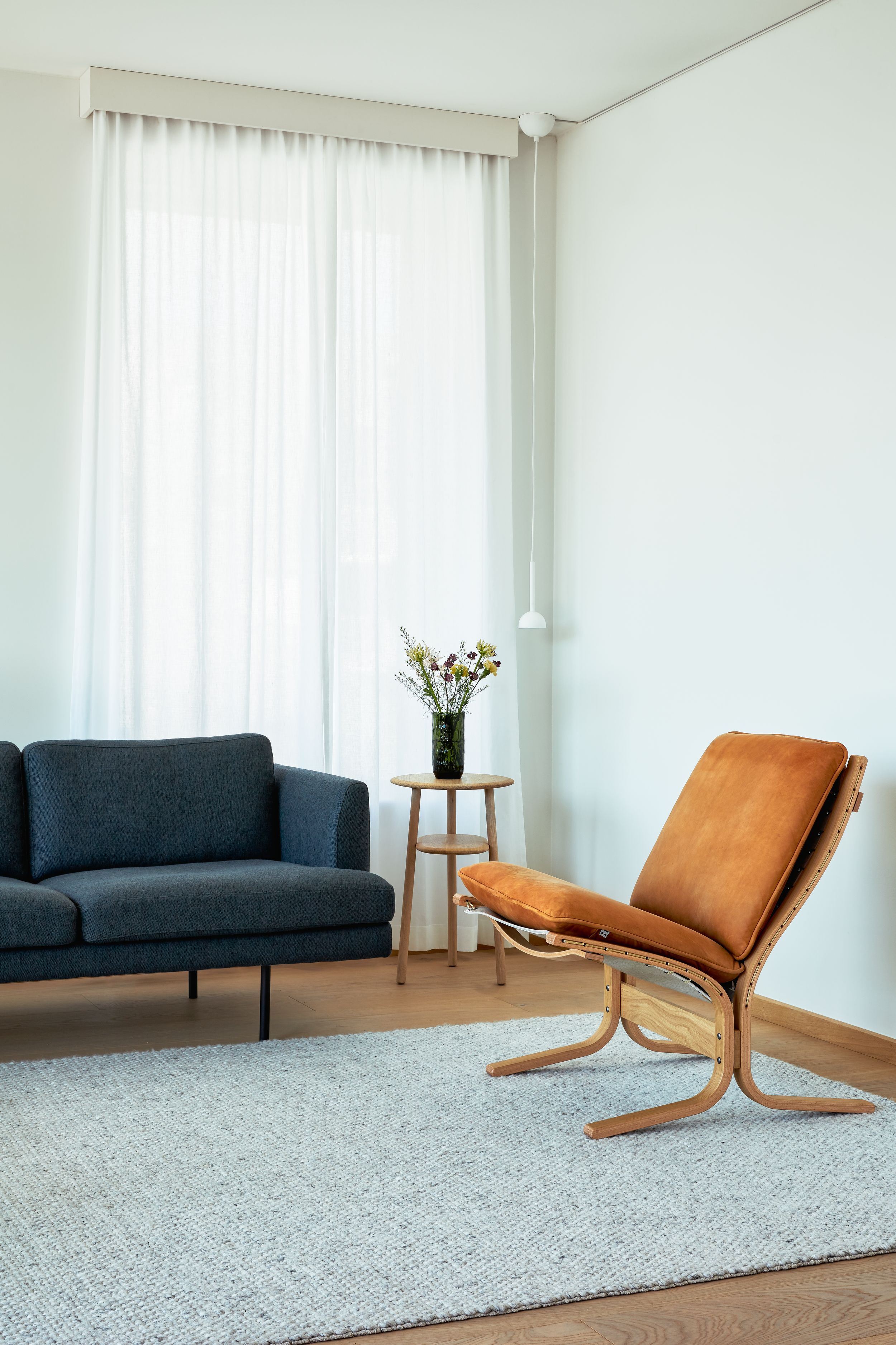 Fri Sofa designed by Jonas Stokke, blue version with Siesta Chair in Scandinavian living room