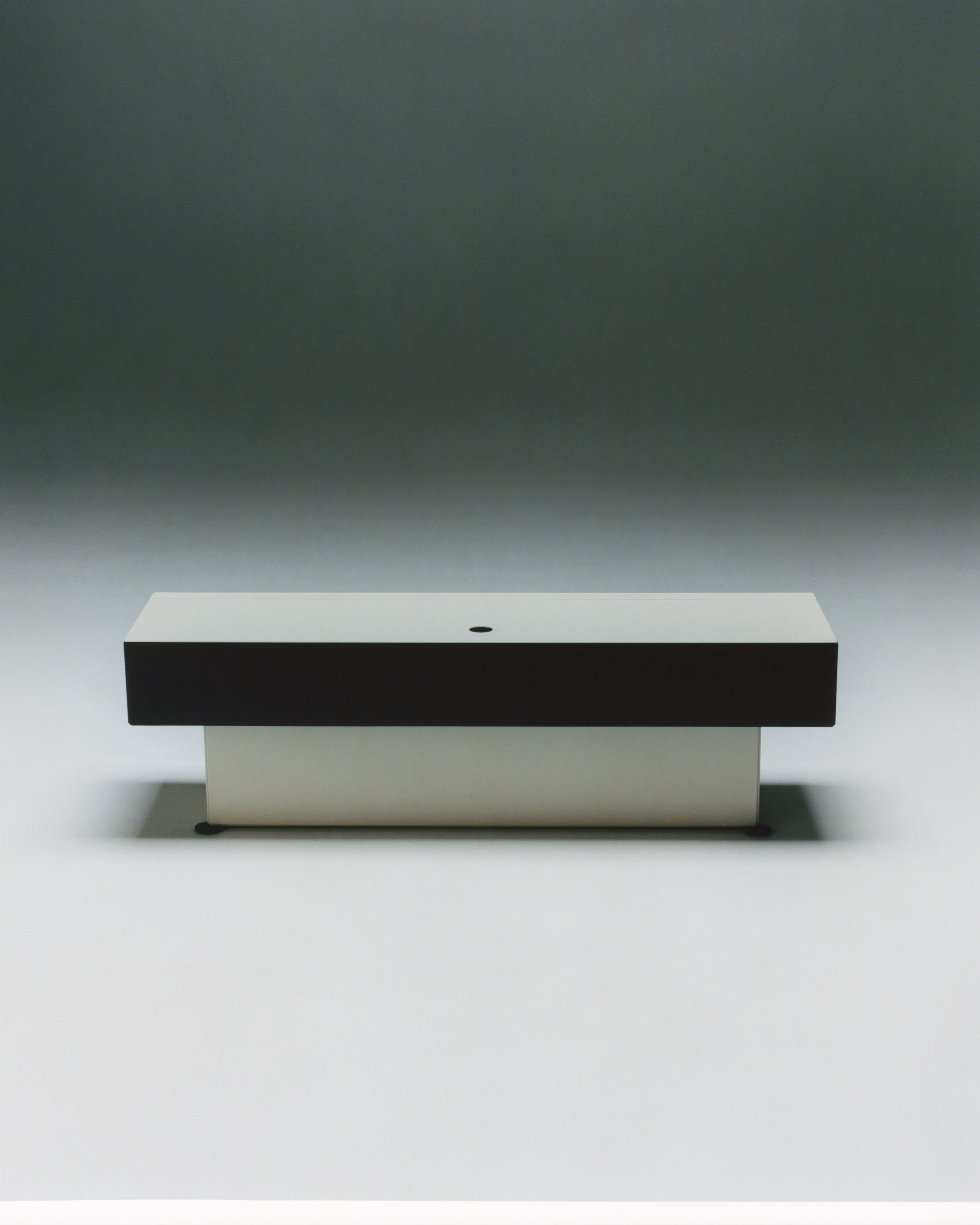unit, a black and white steel cabinet that steps out like an inverted piramyde.