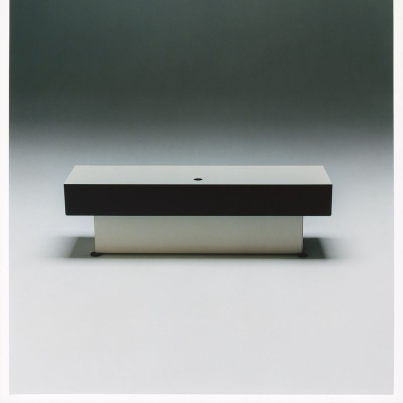 unit, a black and white steel cabinet that steps out like an inverted piramyde.