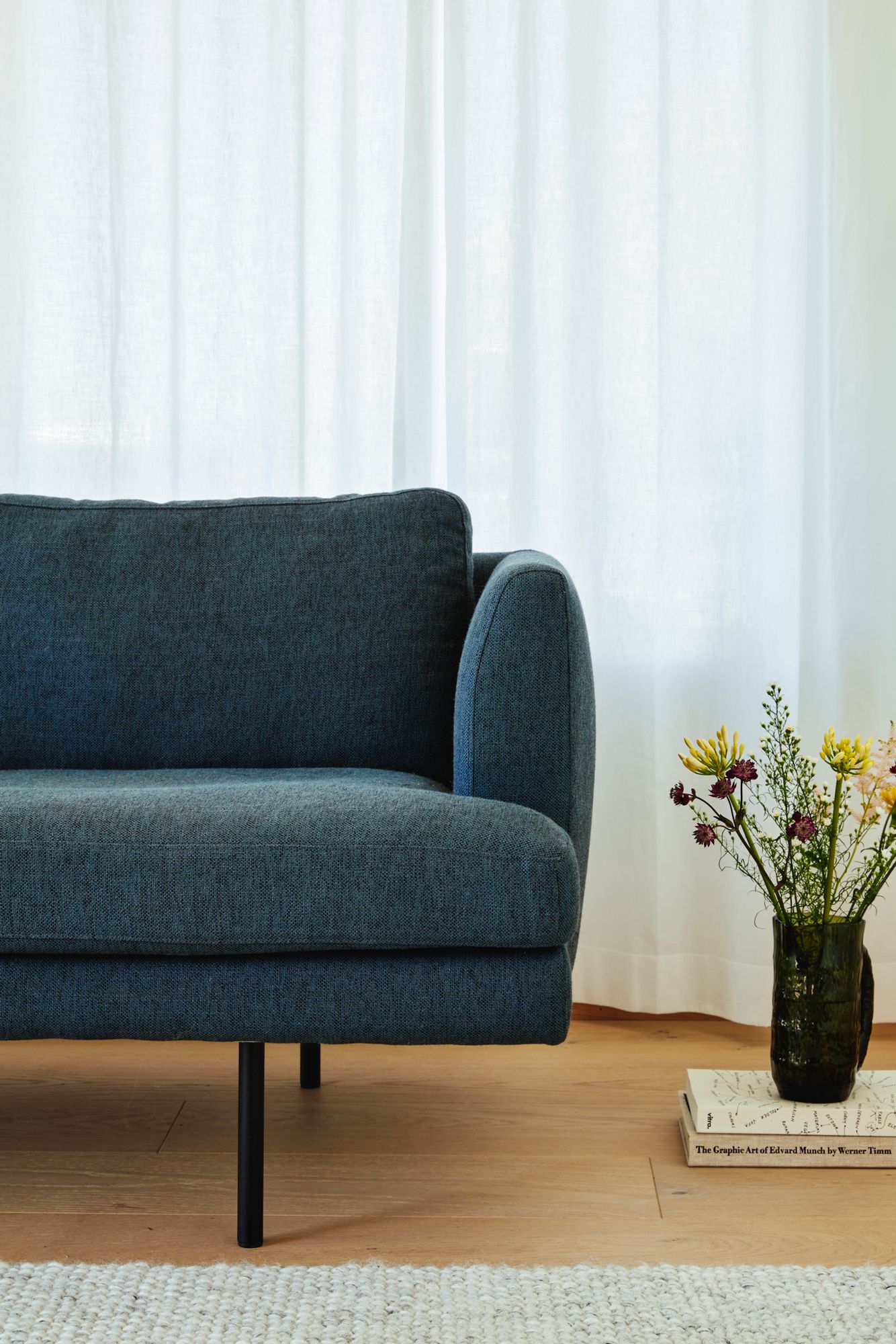 Fri Sofa designed by Jonas Stokke, close up with flower vase in Scandinavian living room