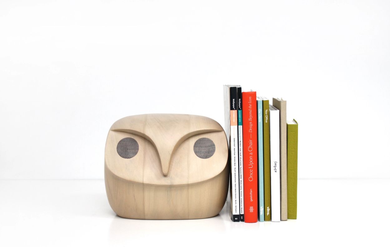 wooden owls with books