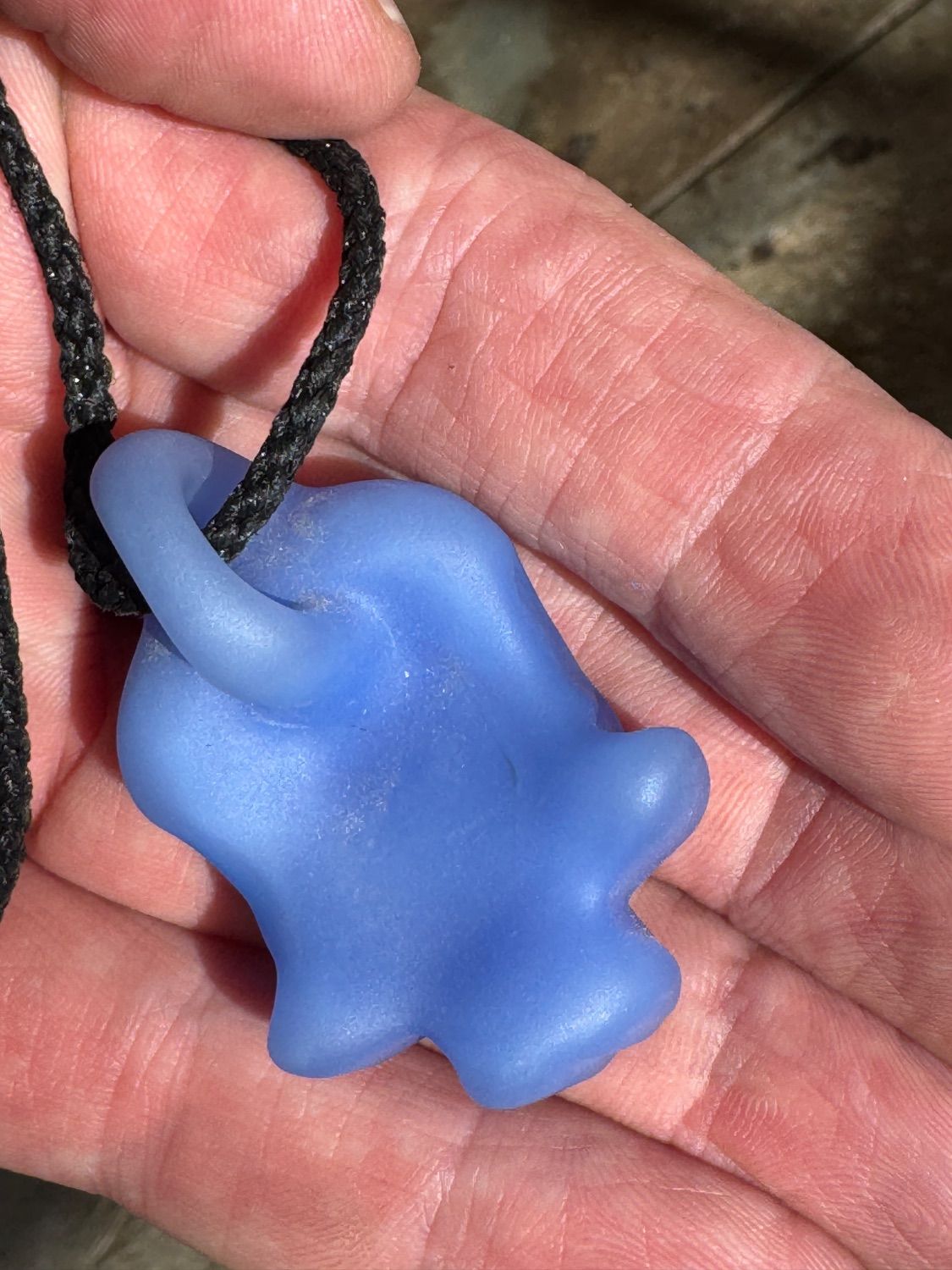 Hand Blown Frosted Blue Glass Skull Pendant Necklace on Black Cord - beerglass