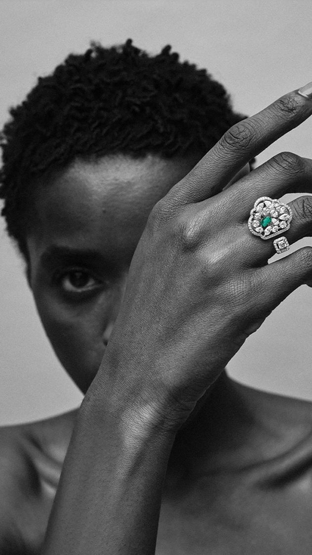 Woman wearing diversa zambian emerald 18k white-gold ring