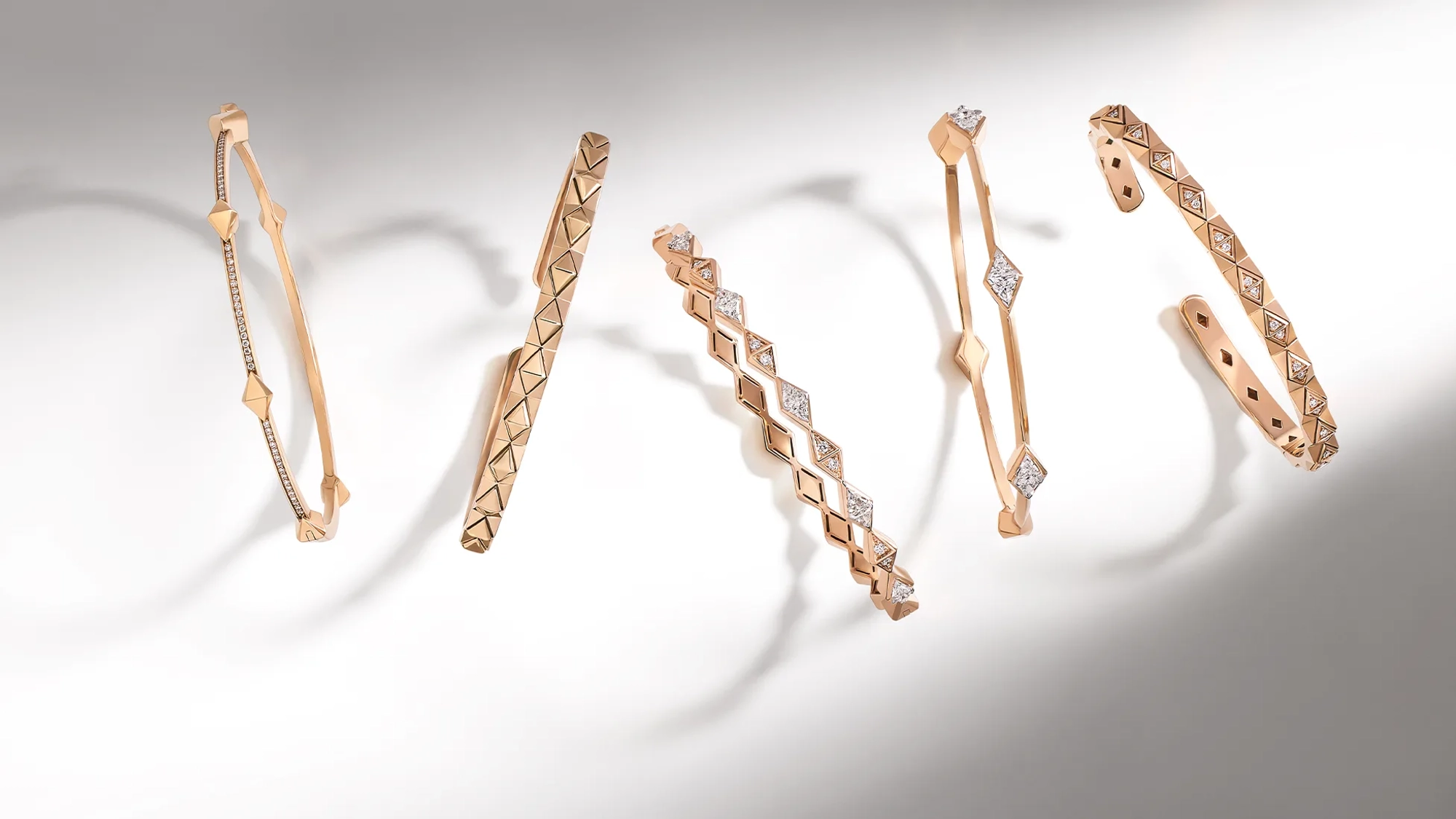 Woman wearing 18k rose gold and diamond jewelry