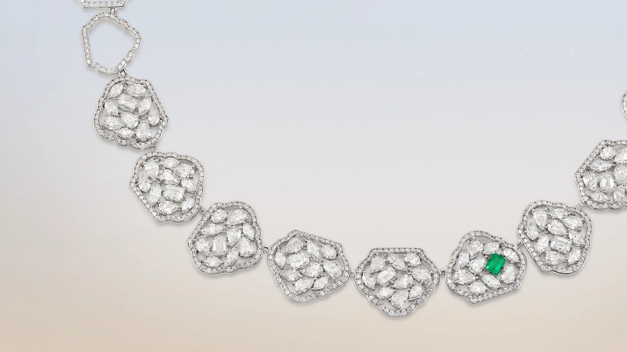 Banner image of a woman wearing Zambian emerald ring
