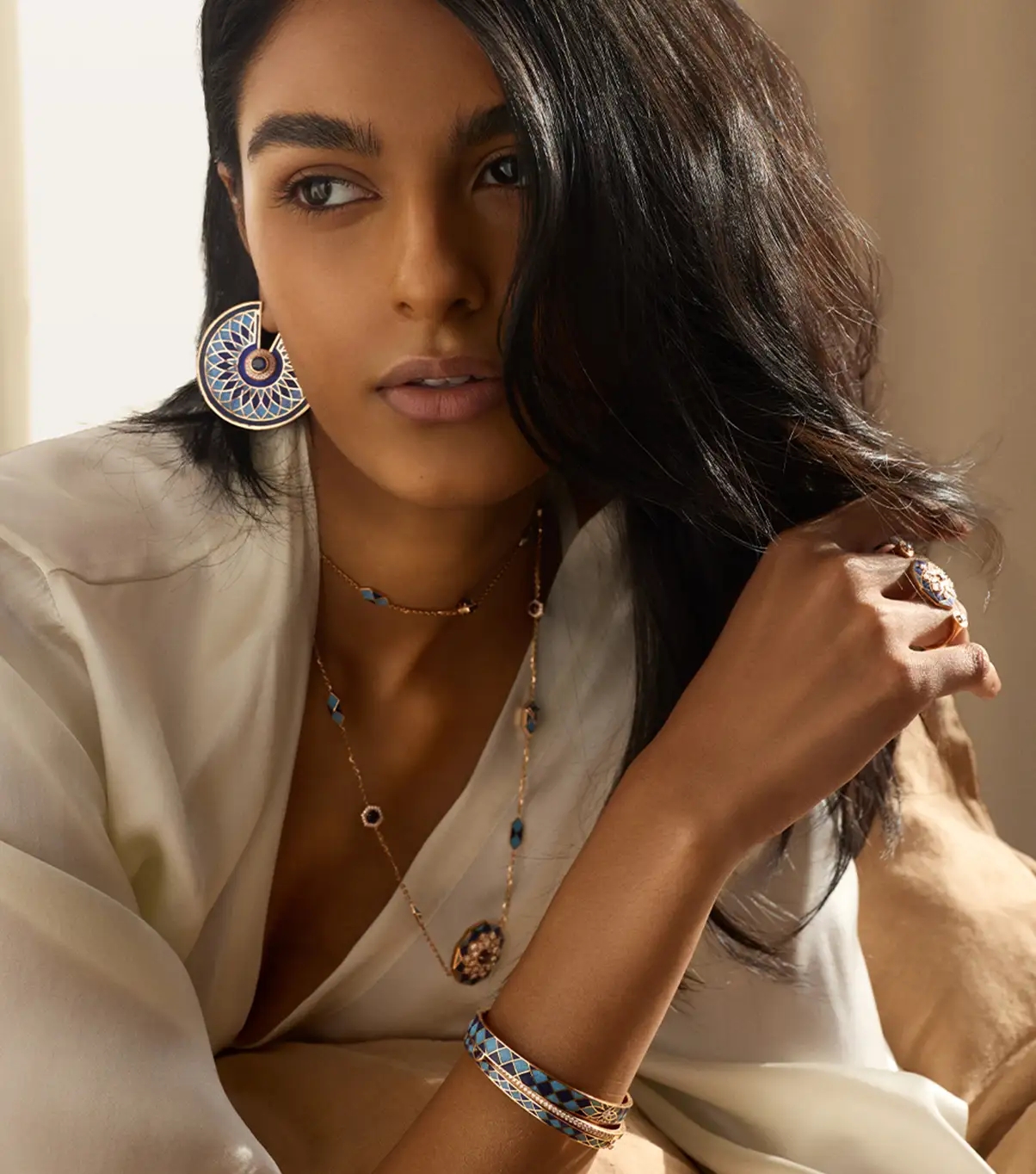 Woman wearing 18k rose gold and diamond jewellery