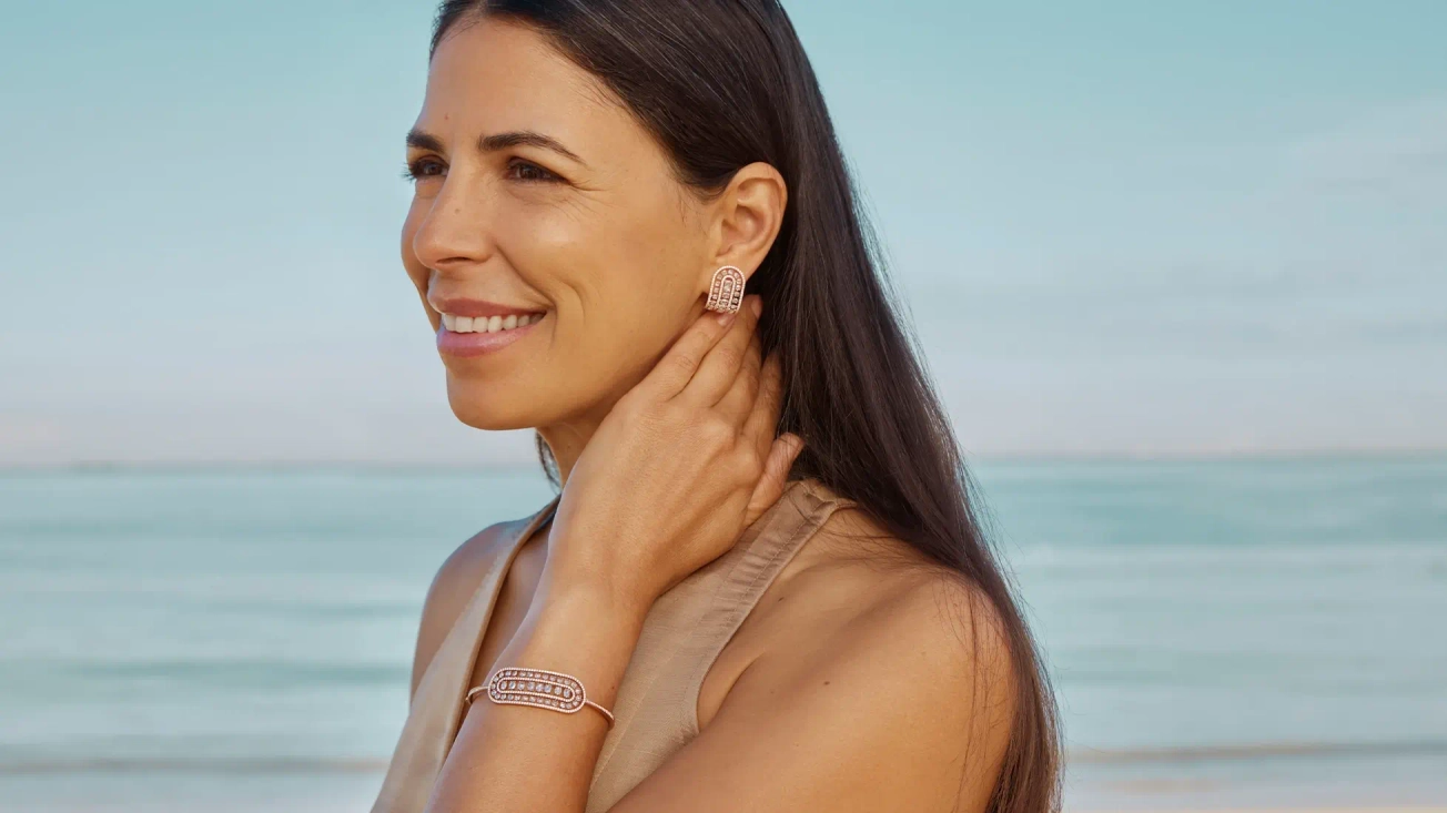Woman wearing 18k rose gold and diamond jewellery