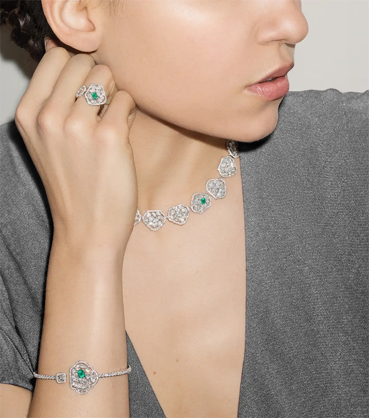 Woman wearing 18k White-Gold Emerald & Diamonds jewels