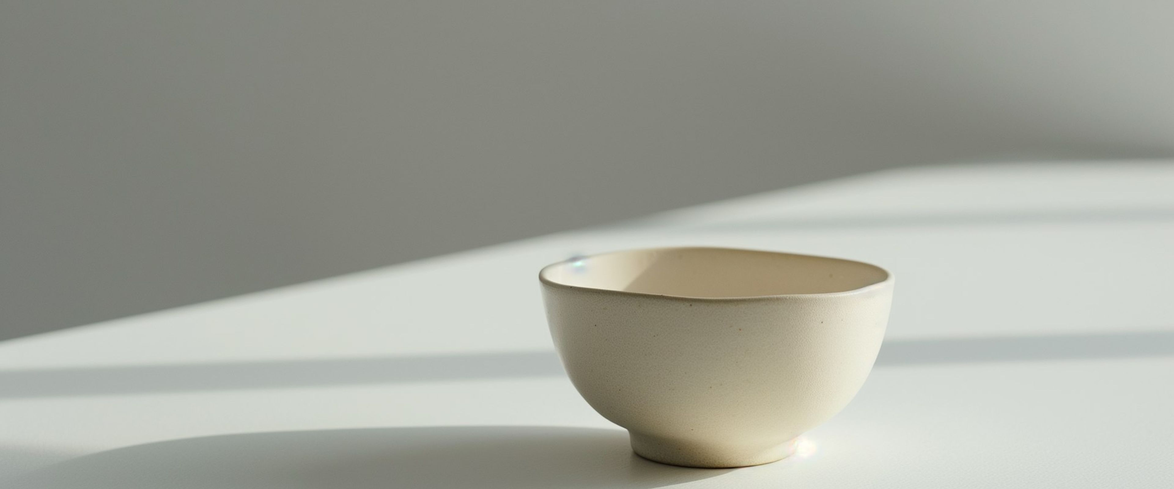 A single ceramic bowl on a pale surface