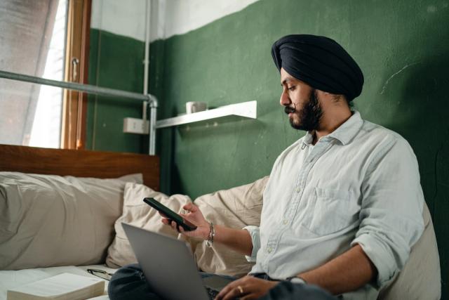 Man looking seriously at laptop