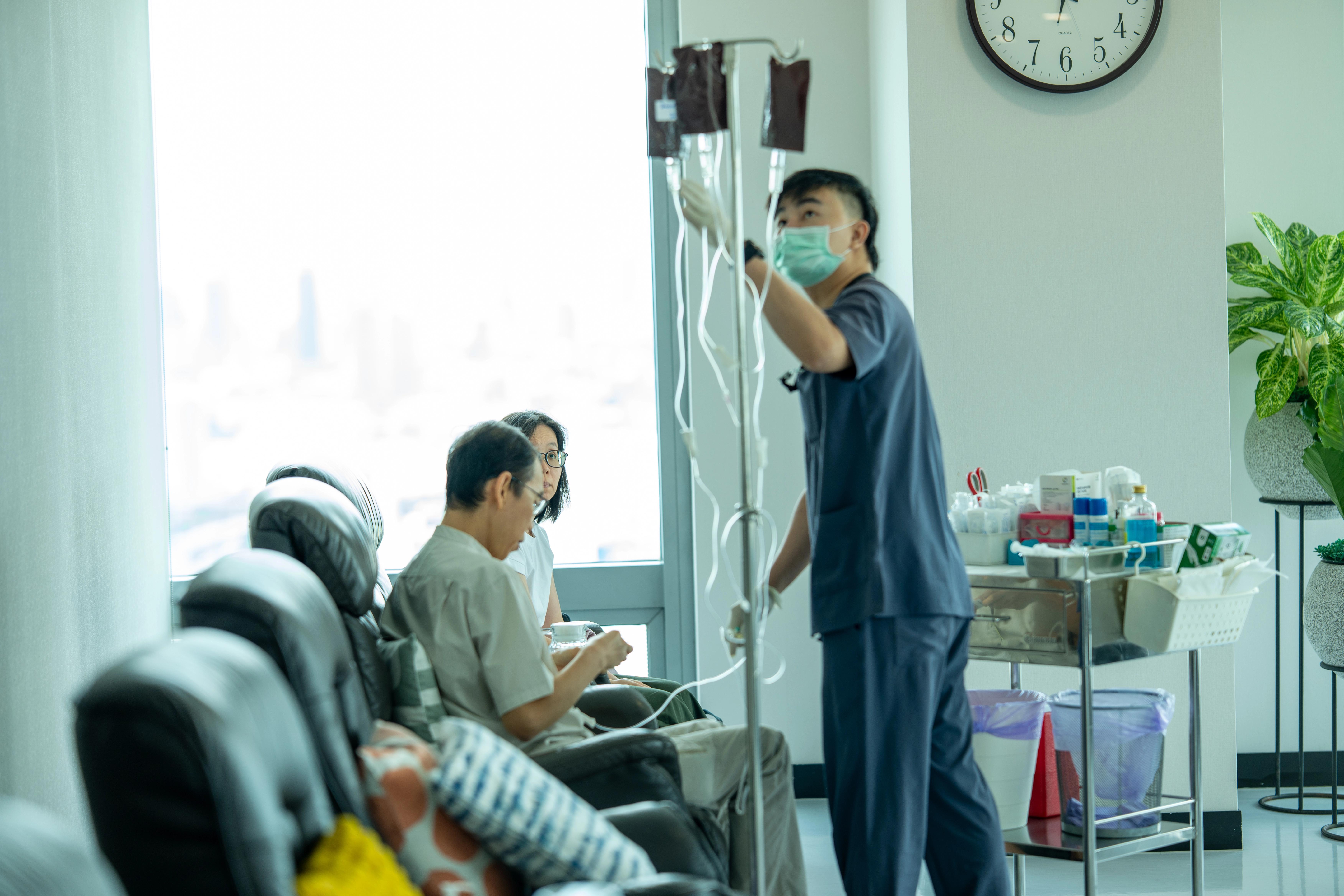 Nurse adjusting IV Drips